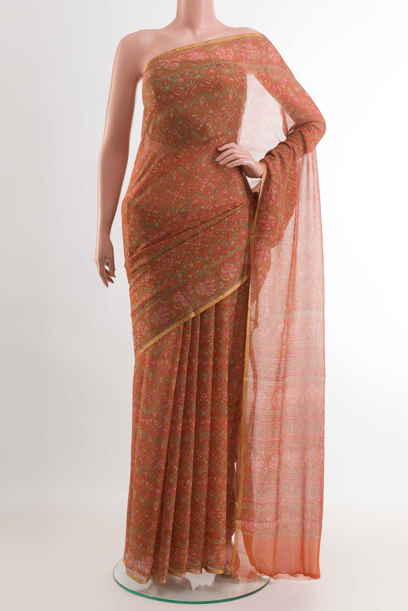 Orange Chiffon Saree with Printed design on the body and Printed Border.  displayed on a mannequin