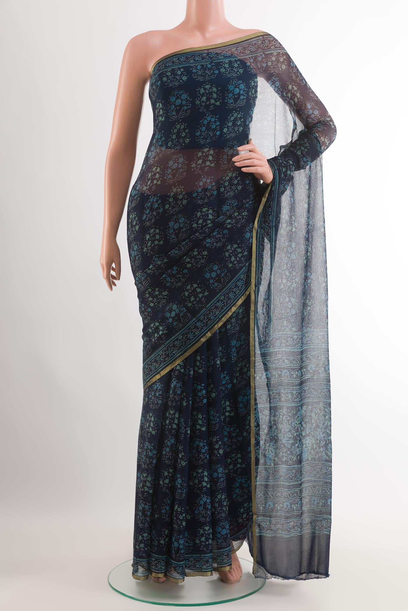 Blue Chiffon Saree with Printed design on the body and Plain Border.  displayed on a mannequin