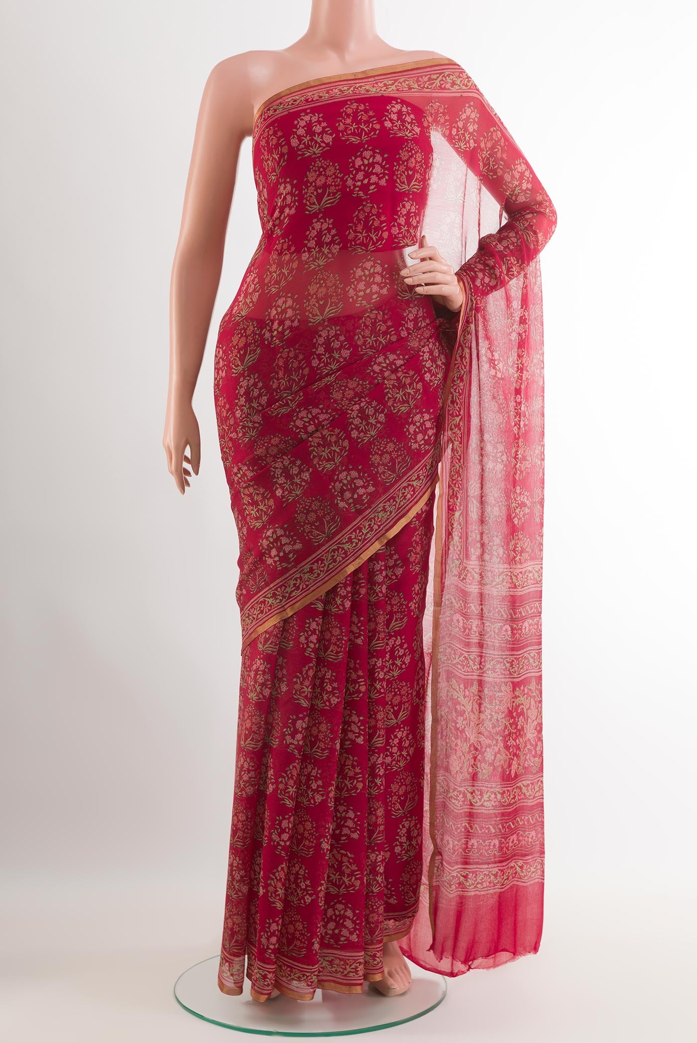 Red Chiffon Saree with Printed design on the body and Plain Border.  displayed on a mannequin