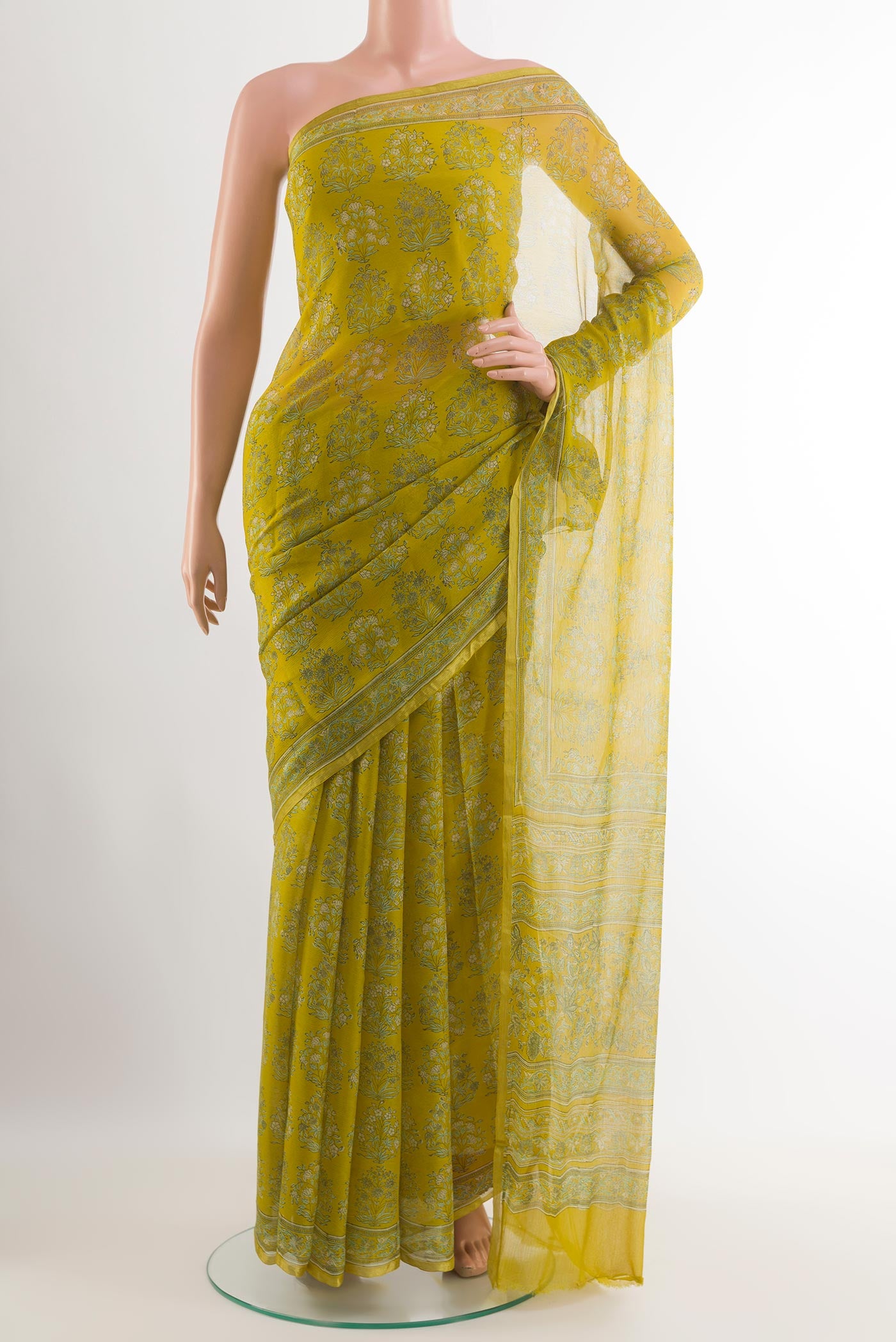 Yellow Chiffon Saree with Printed design on the body and Plain Border.  displayed on a mannequin