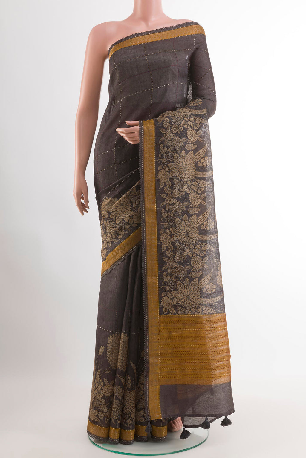 Black Tussar Saree with Checked design on the body and Zari Border.  displayed on a mannequin