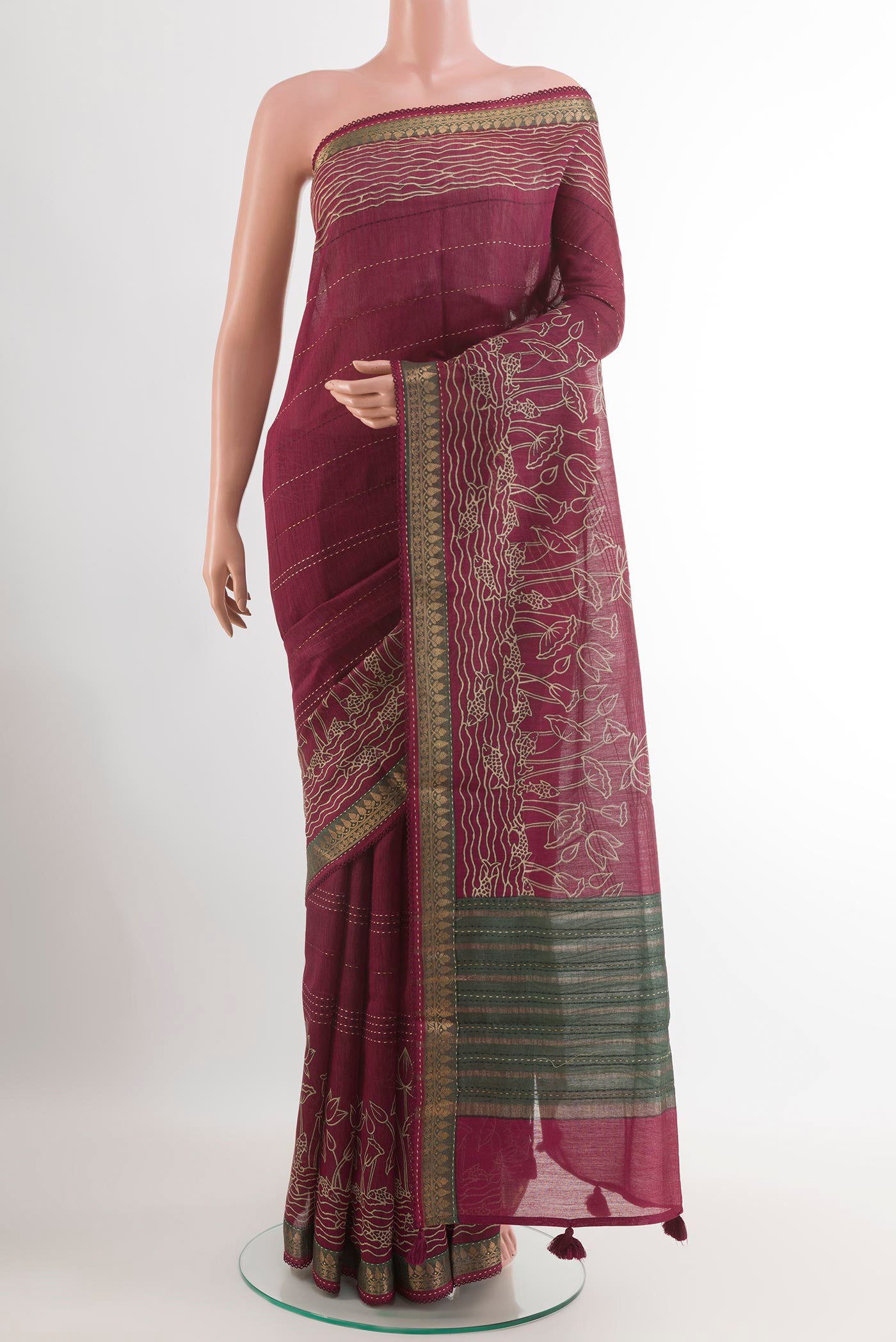 Purple Tussar Saree with Printed design on the body and Zari Border.  displayed on a mannequin
