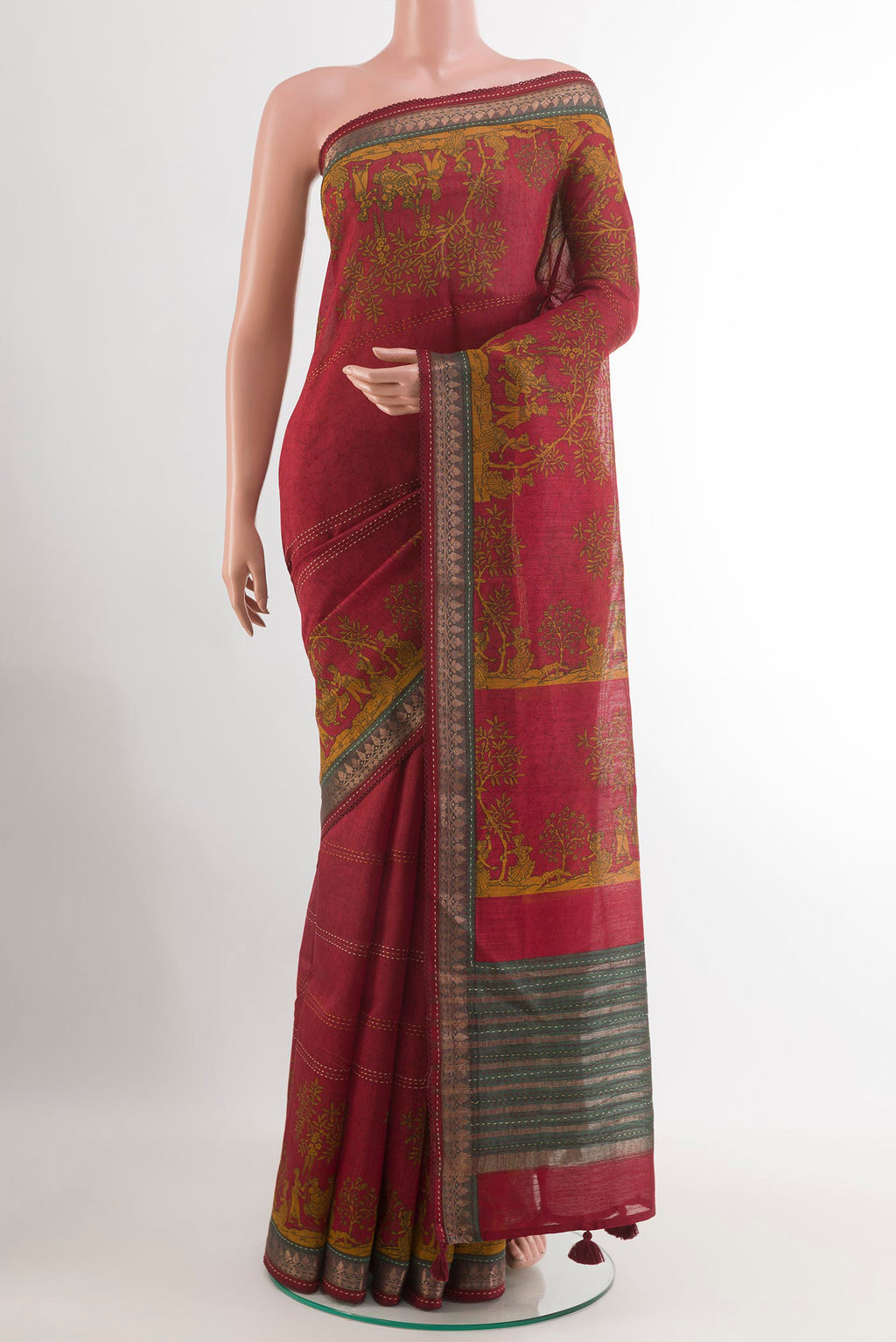 Maroon Tussar Saree with Printed design on the body and Zari Border.  displayed on a mannequin
