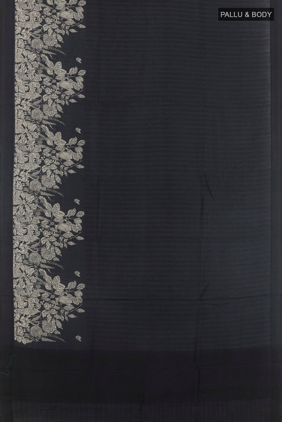 Flat view of Black Tussar Saree with Printed design on the body and Thread Embroidery Border. 