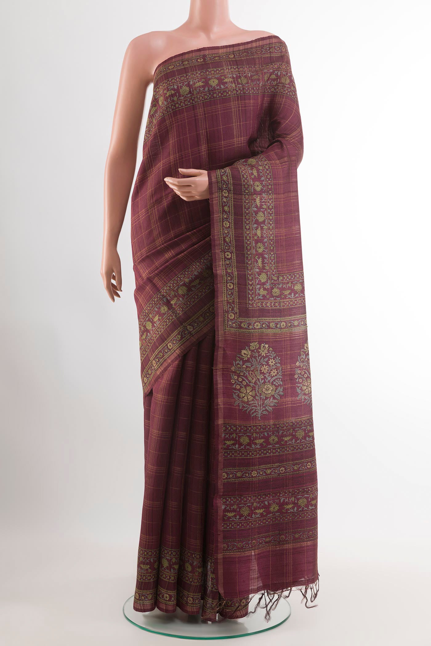 Magenta Tussar Saree with Checked design on the body and Zari Border.  displayed on a mannequin