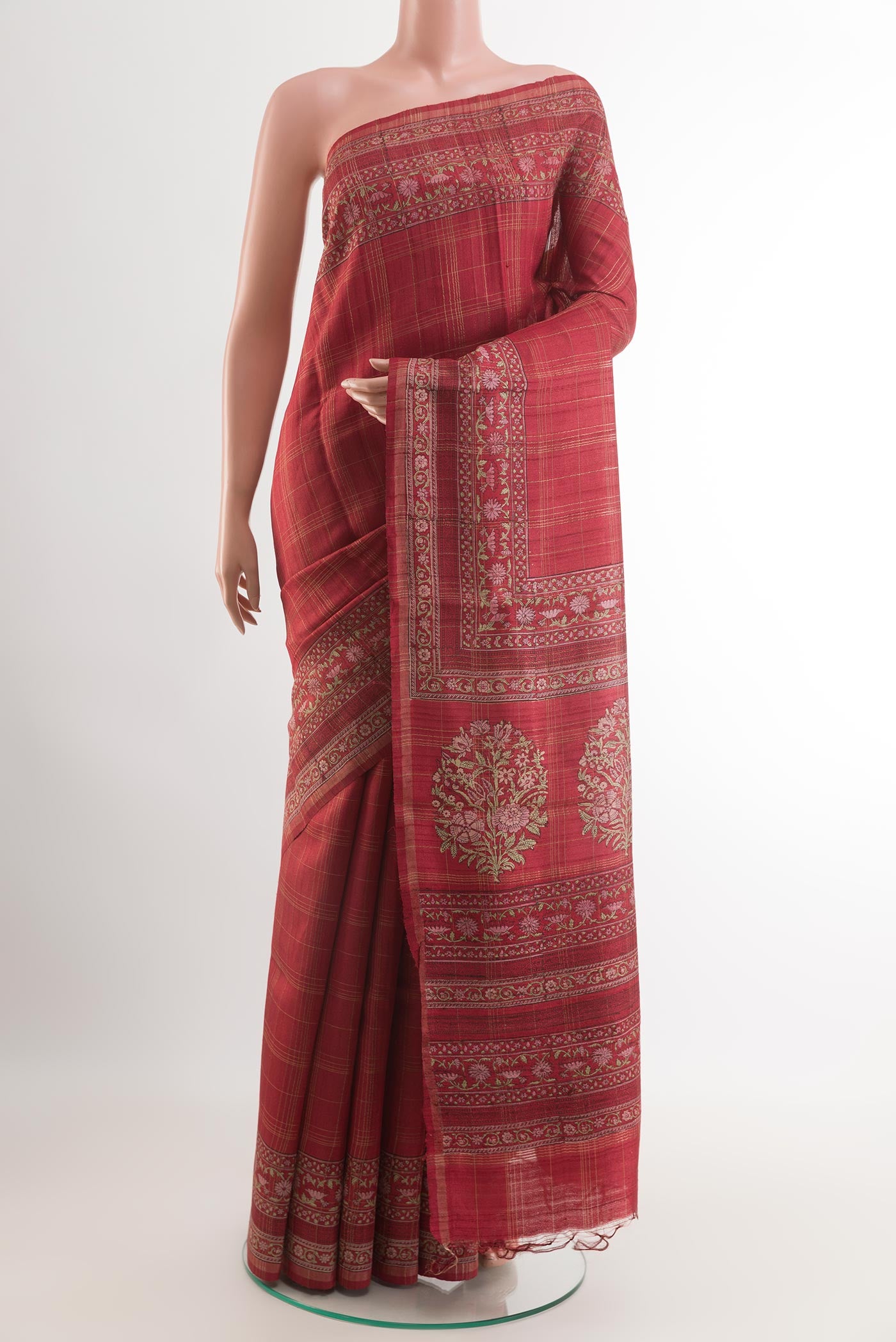 Red Tussar Saree with Checked design on the body and Zari Border.  displayed on a mannequin