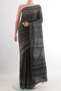 Dark Blue Tussar Saree with Stripes on the body and Zari Border.  displayed on a mannequin