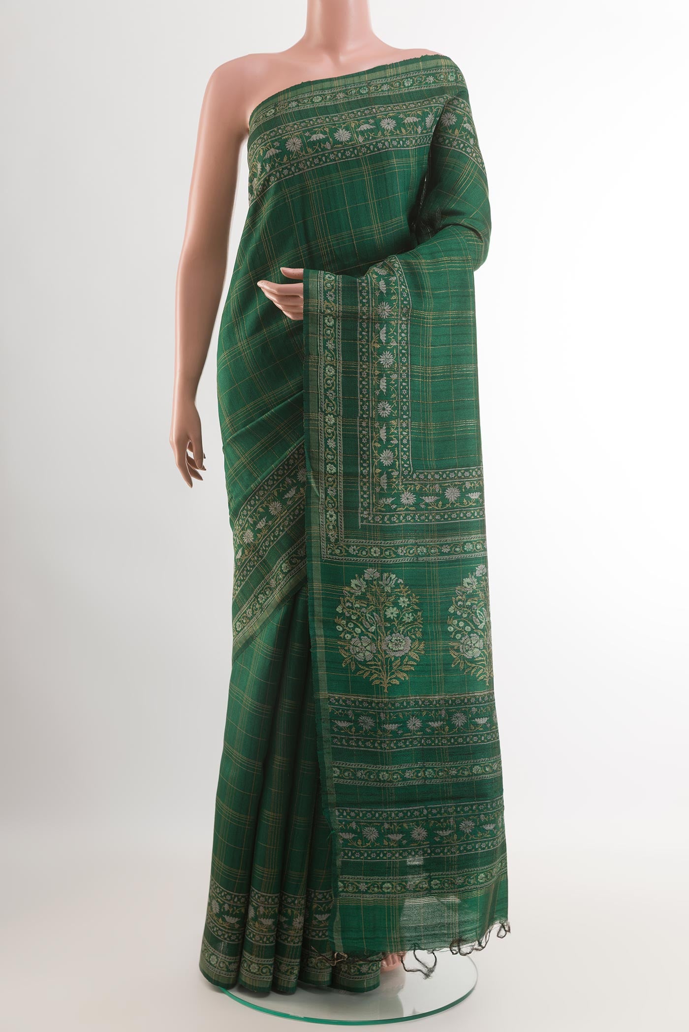 Green Tussar Saree with Checked design on the body and Zari Border.  displayed on a mannequin