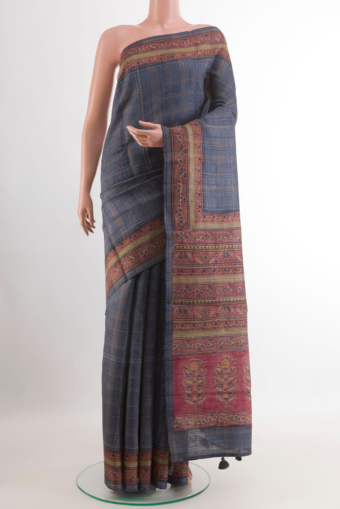 Grey Tussar Saree with Stripes on the body and Zari Border.  displayed on a mannequin