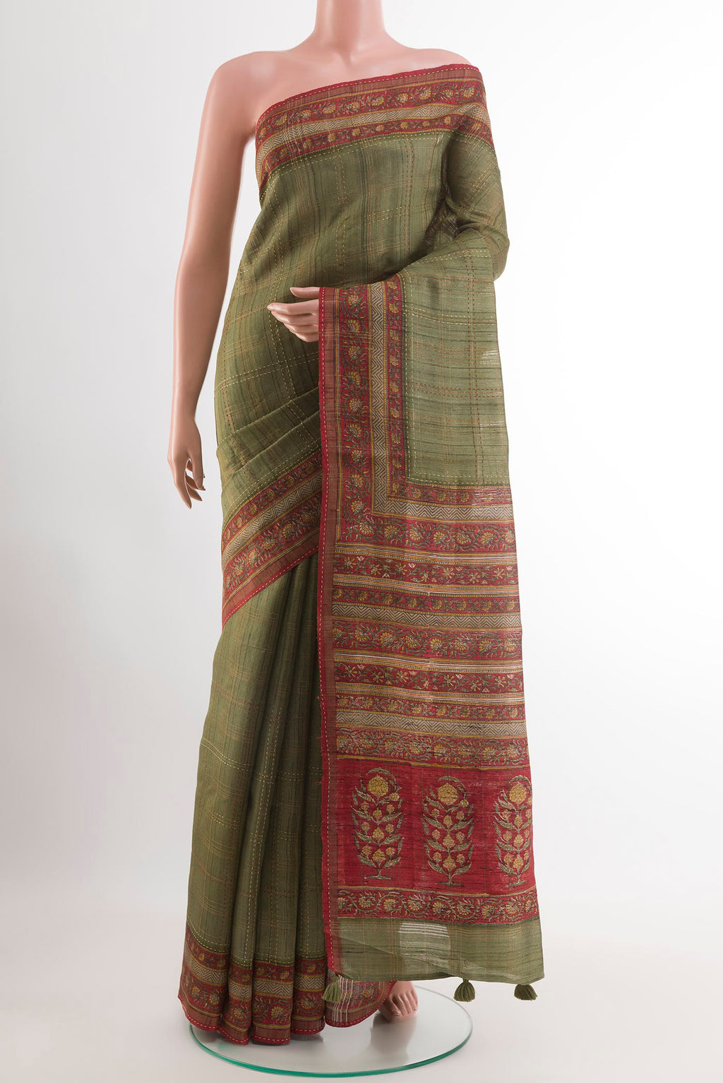 Green Tussar Saree with Checked design on the body and Zari Border.  displayed on a mannequin