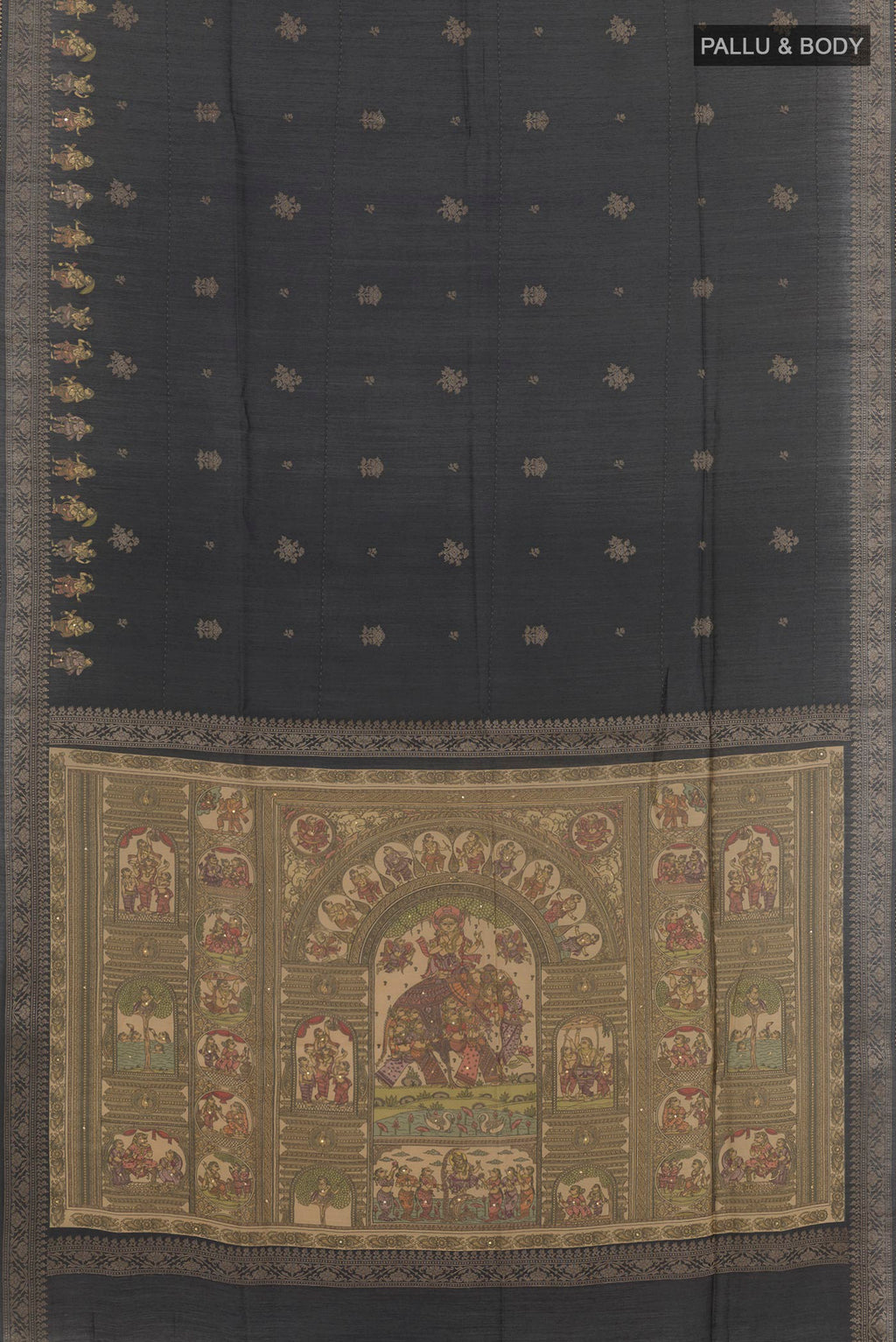 Flat view of Black Tussar Saree with Zari Butta on the body and Zari Border. 