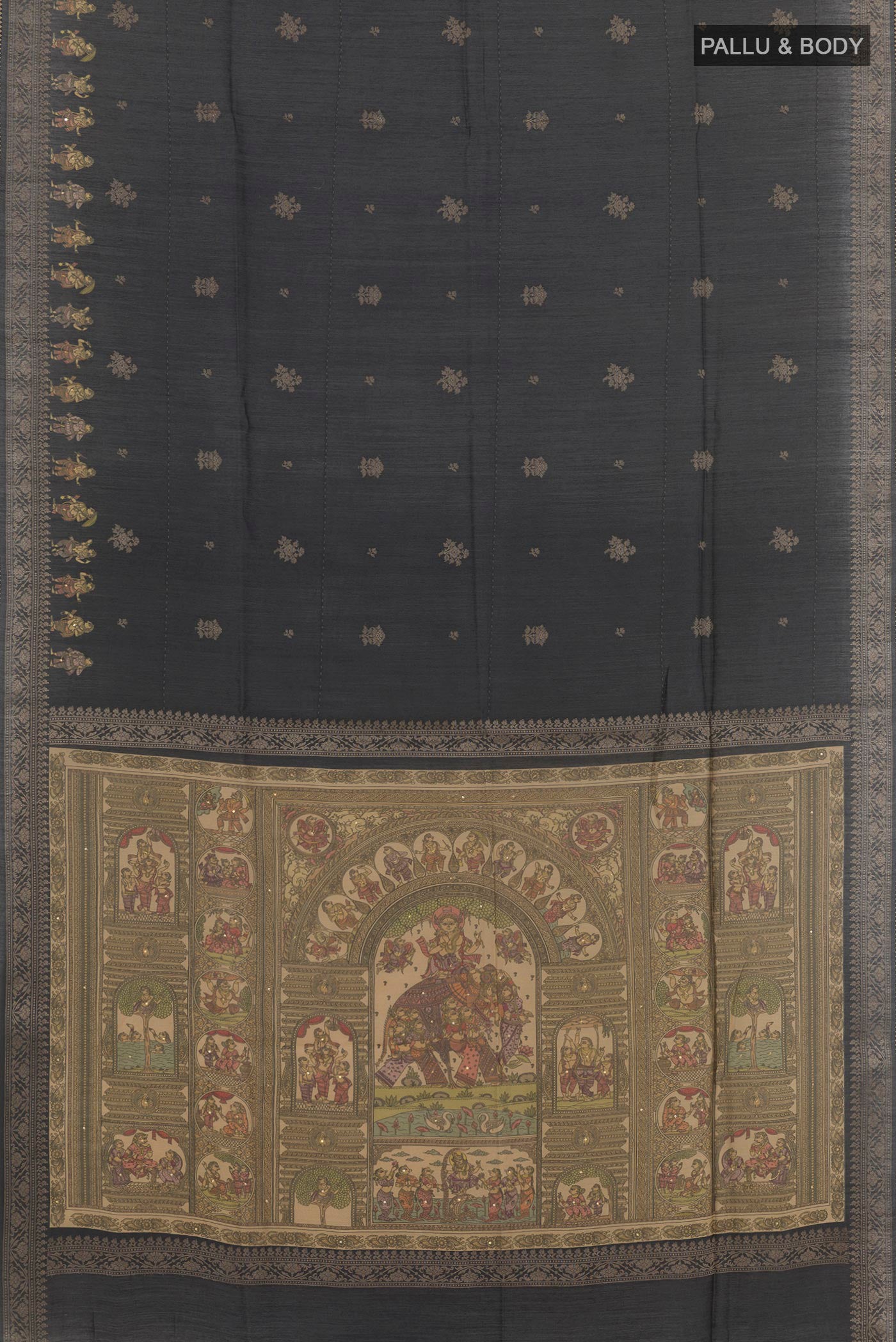 Flat view of Black Tussar Saree with Zari Butta on the body and Zari Border. 