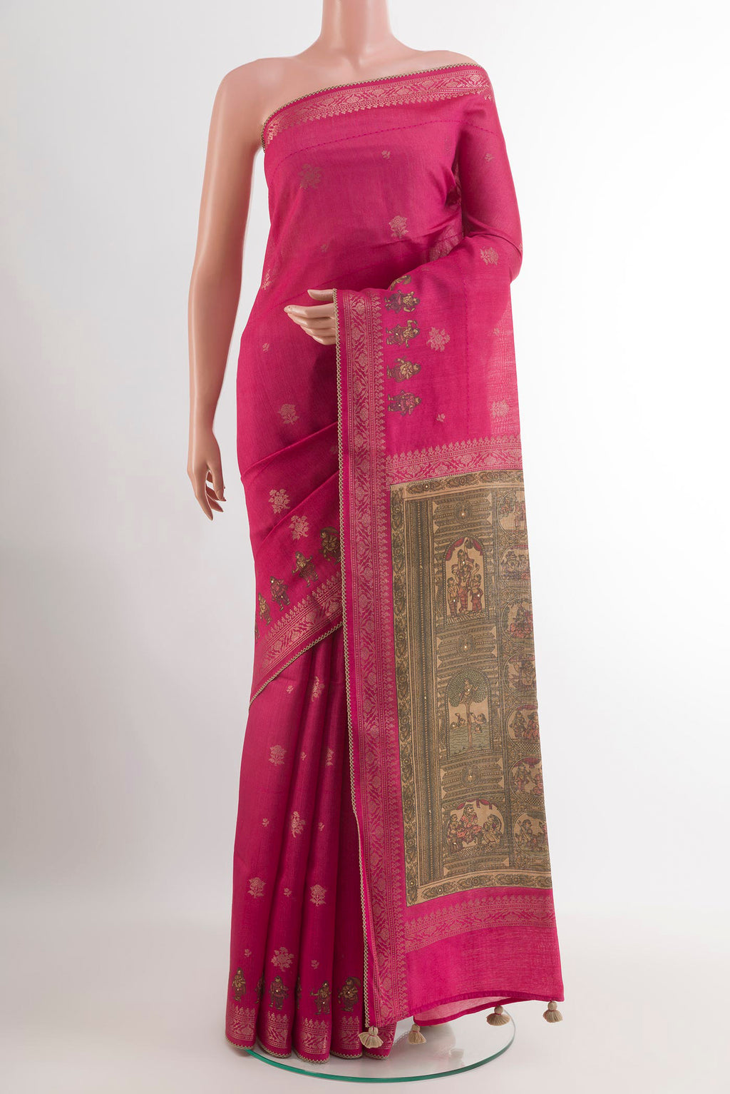 Pink Tussar Saree with Zari Butta on the body and Zari Border.  displayed on a mannequin