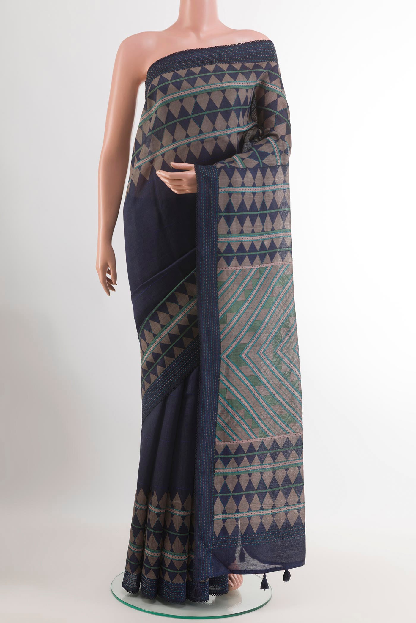 Blue Tussar Saree with Printed design on the body and Thread Embroidery Border.  displayed on a mannequin