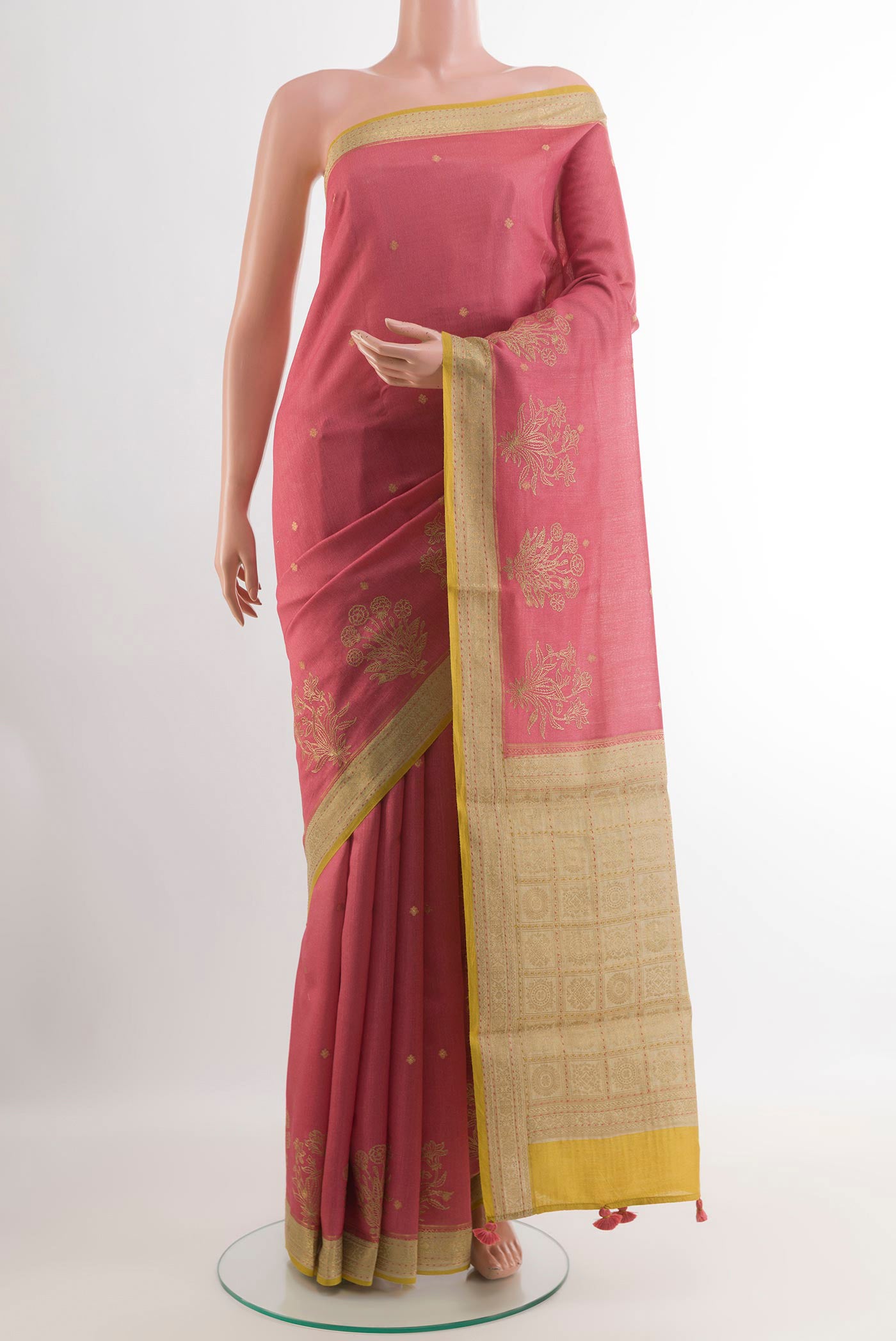 Pink Tussar Saree with Zari Butta on the body and Zari Border.  displayed on a mannequin