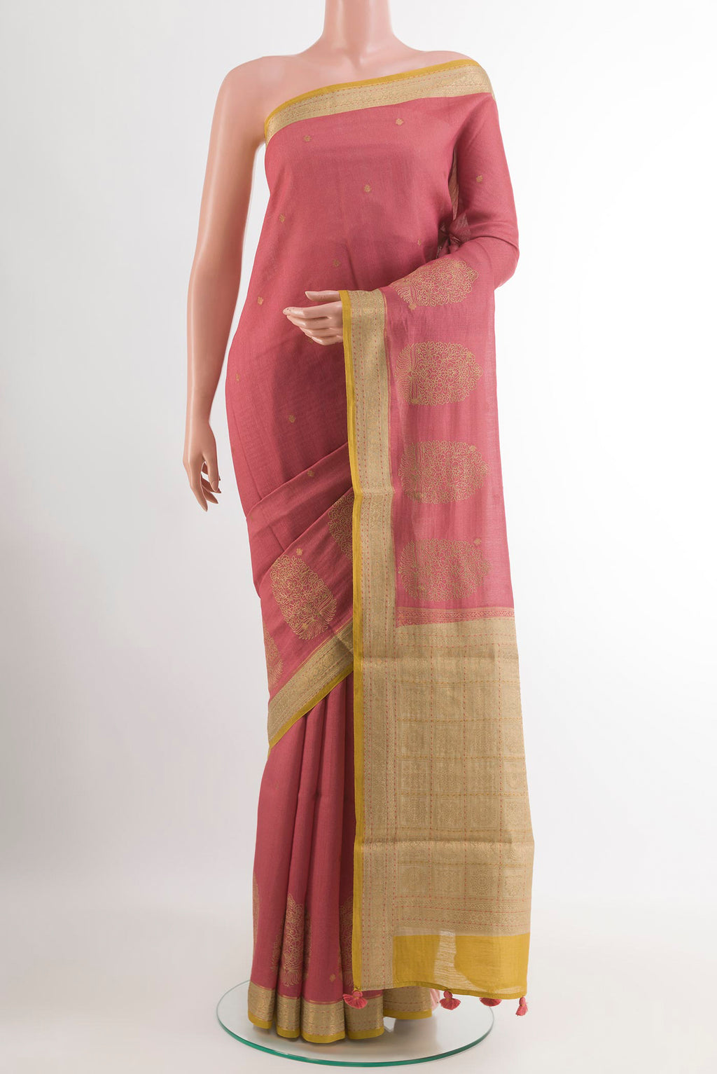 Pink Tussar Saree with Zari Butta on the body and Zari Border.  displayed on a mannequin