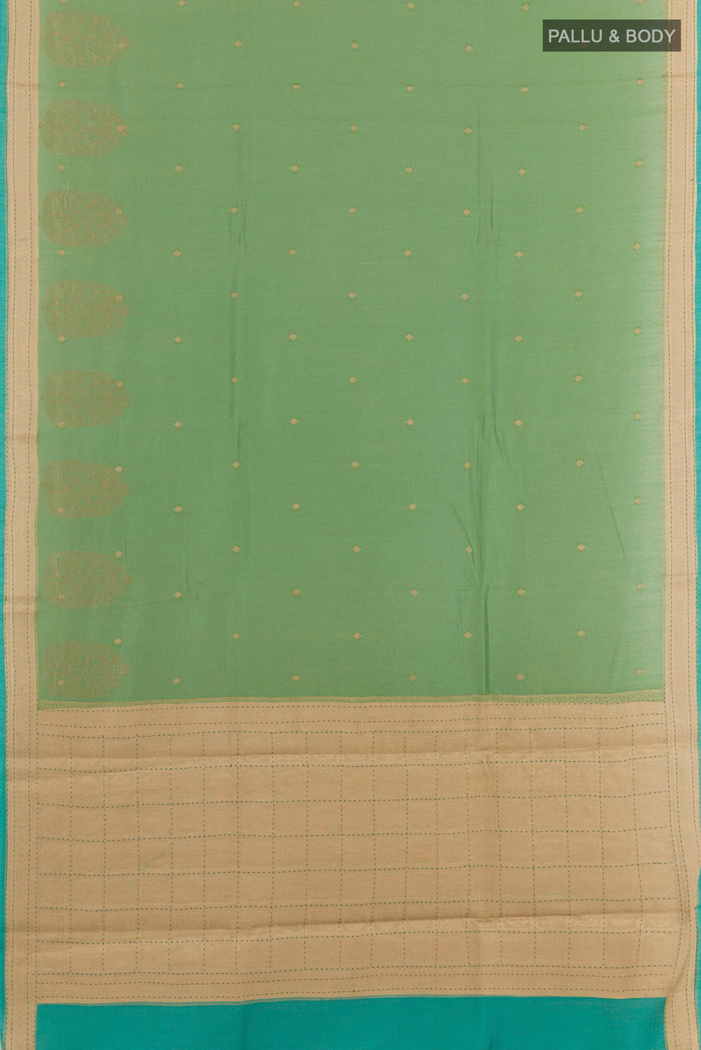 Flat view of Green Tussar Saree with Zari Butta on the body and Zari Border. 