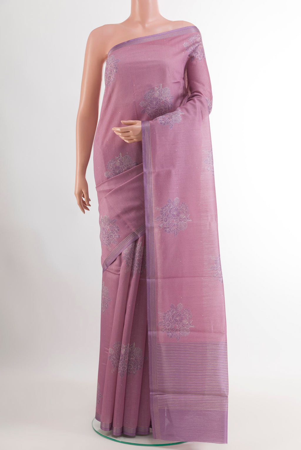 Lavender Tussar Saree with Printed design on the body and Zari Border.  displayed on a mannequin
