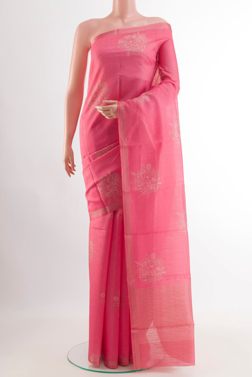 Pink Tussar Saree with Printed design on the body and Zari Border.  displayed on a mannequin
