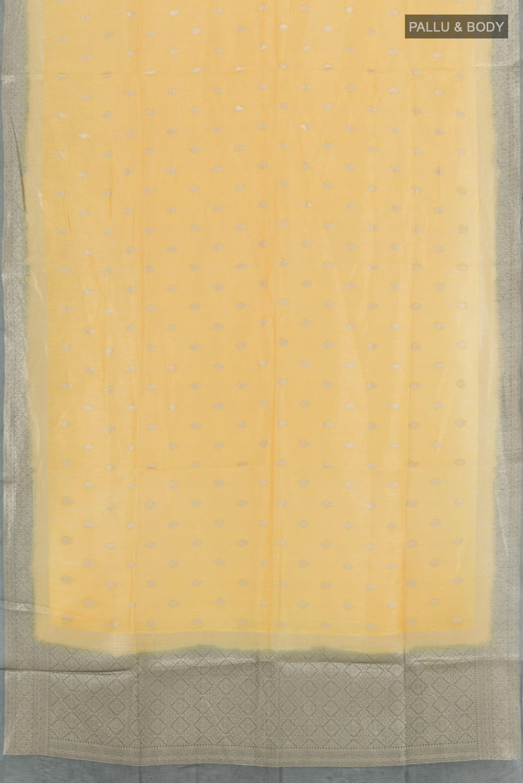 Flat view of Yellow Linen Saree with Zari Butta on the body and Zari Border. 