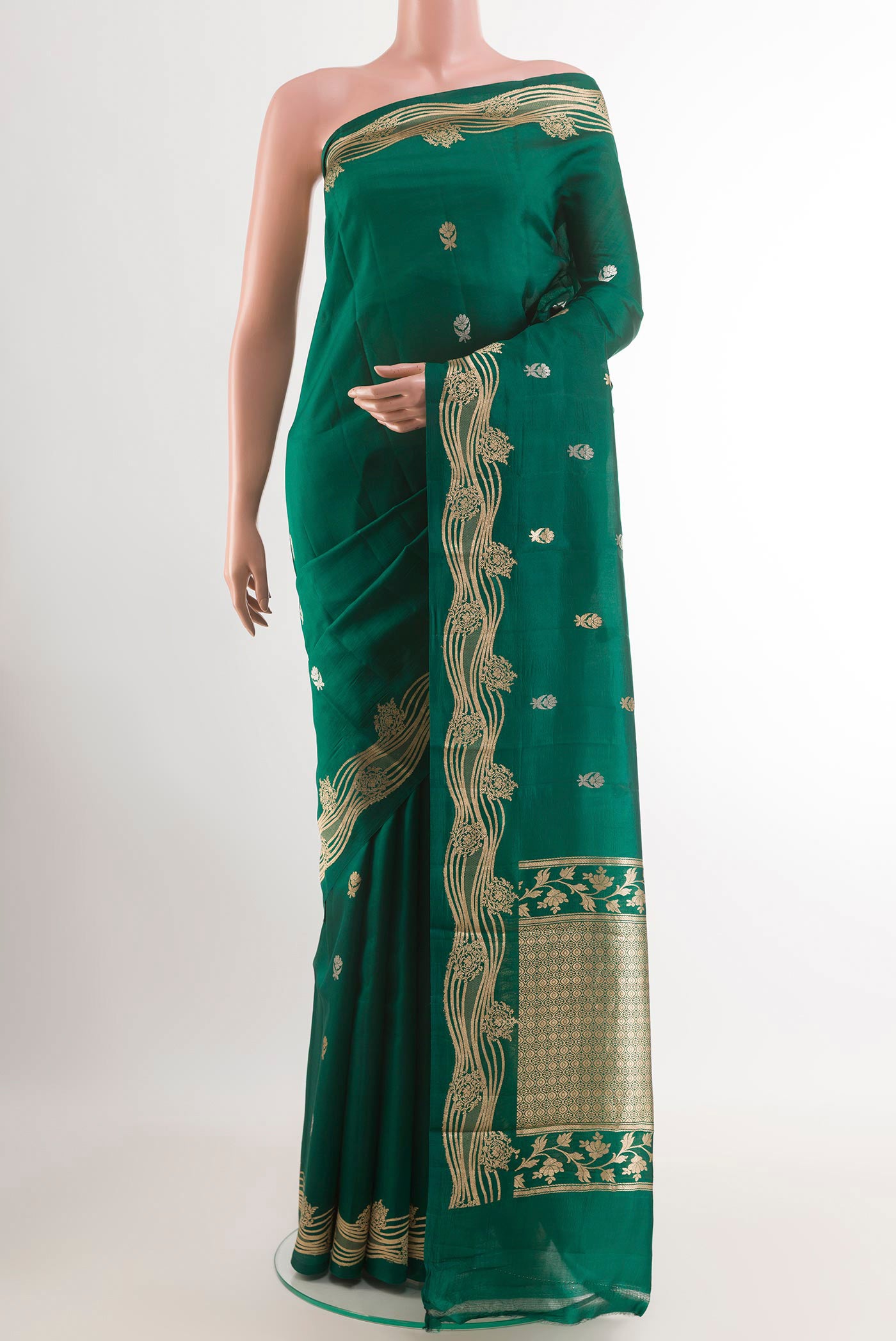 Green Banarasi Katan Silk Saree with Zari Butta on the body and Zari Border.  displayed on a mannequin