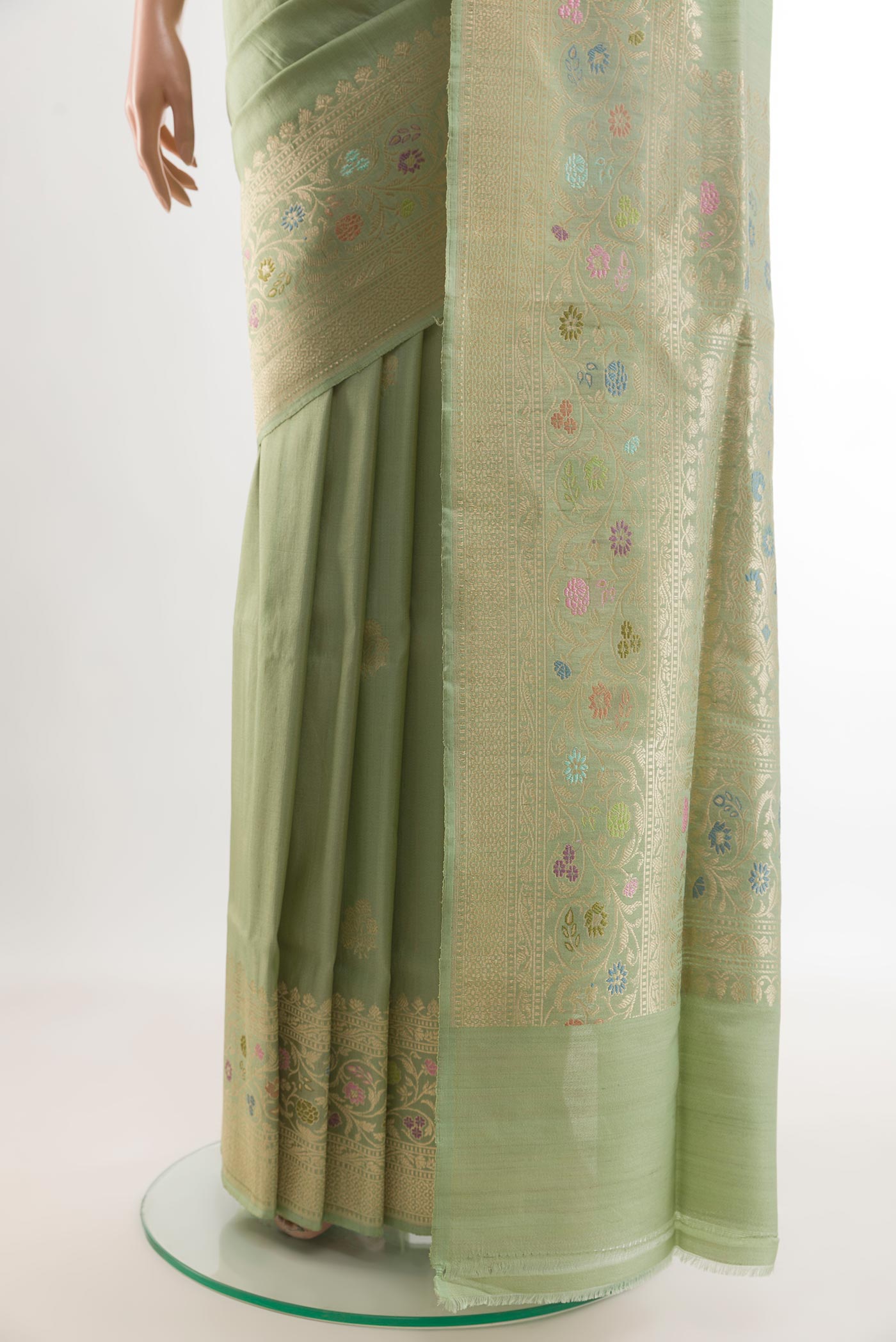 Pleats and pallu of Pista Green Banarasi Tussar Silk Saree with Zari Butta on the body and Zari Border. 