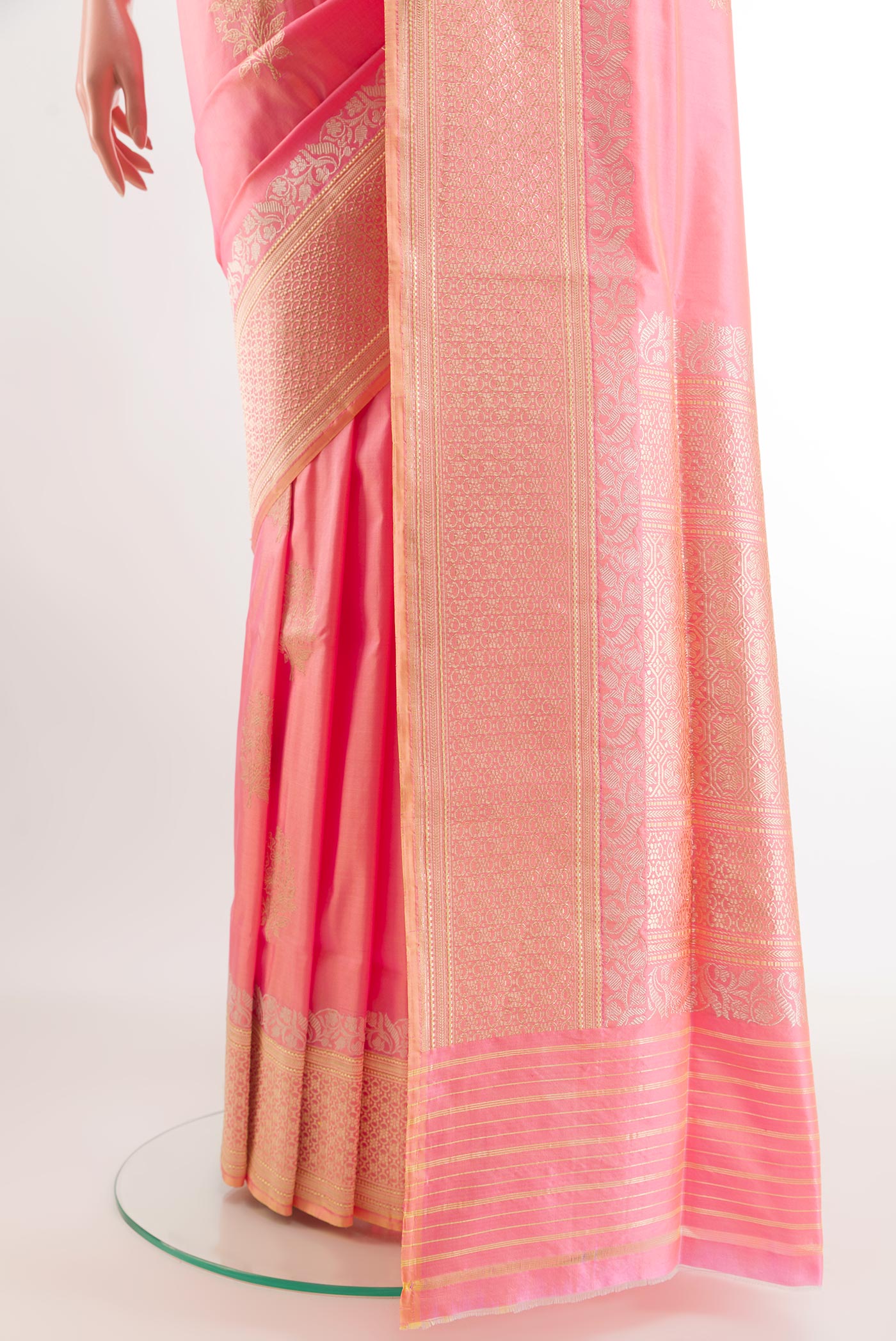 Pleats and pallu of Rose pink Banarasi Silk Saree with Zari Butta on the body and Zari Border. 