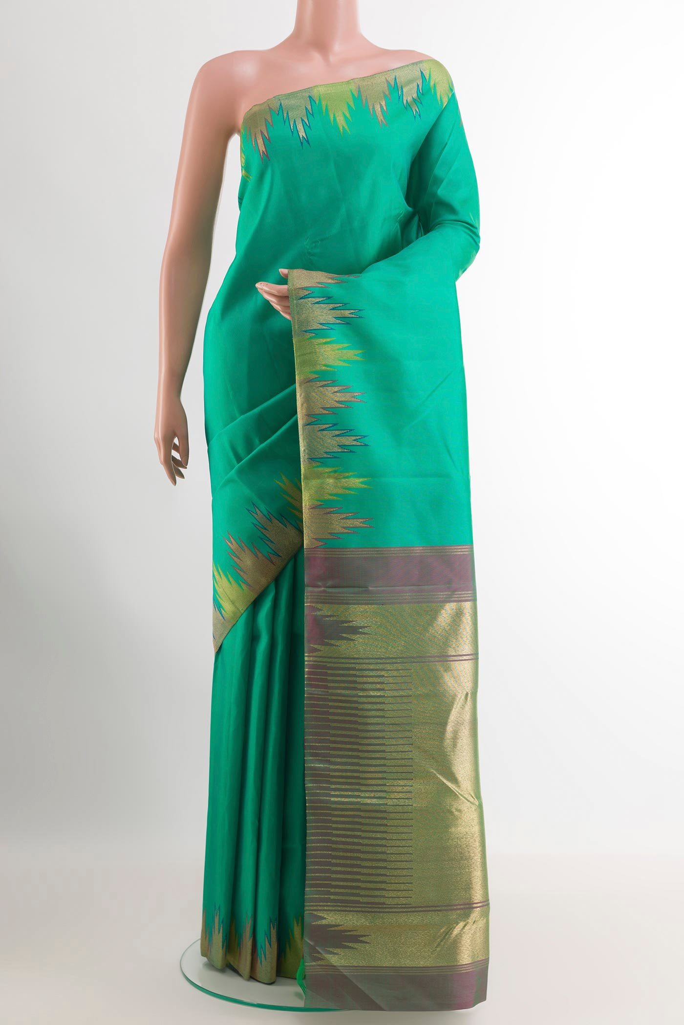 Green Kanchipuram Silk Saree with Plain Body and Zari Border.  displayed on a mannequin