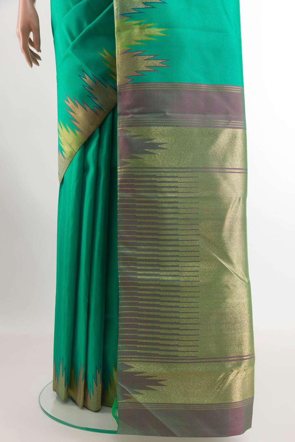 Pleats and pallu of Green Kanchipuram Silk Saree with Plain Body and Zari Border. 