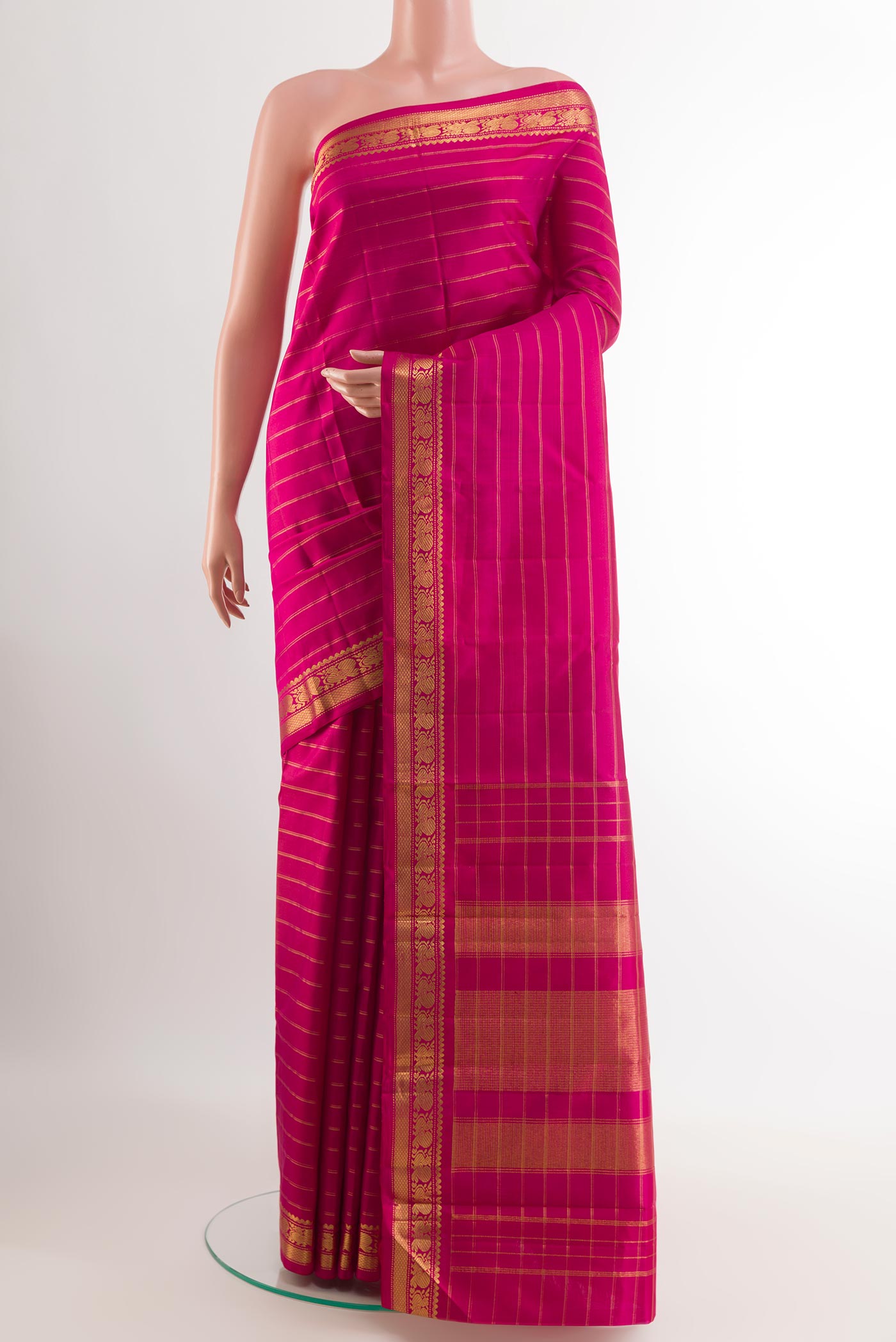 Pink Kanchipuram Silk Saree with Stripes on the body and Zari Border.  displayed on a mannequin
