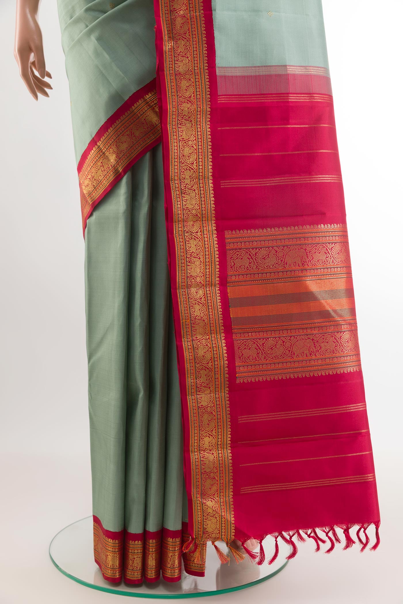 Pleats and pallu of Grey Kanchipuram Silk Saree with Zari Butta on the body and Zari Border. 