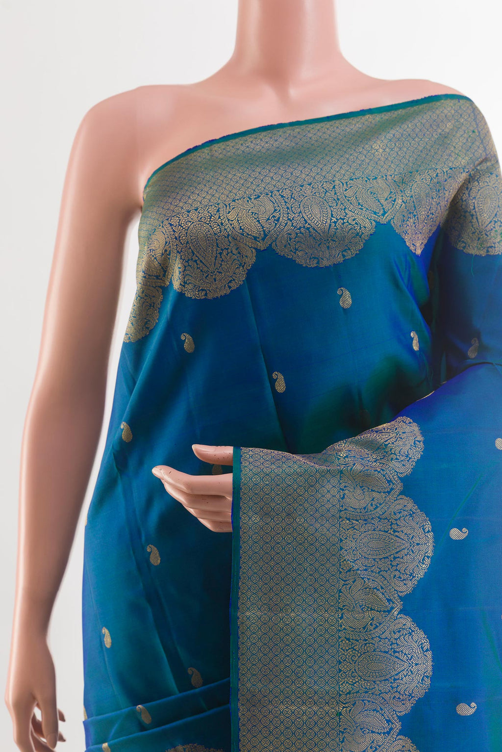 Border image of Peacock Blue Kanchipuram Silk Saree with Zari Butta on the body and Zari Border. 