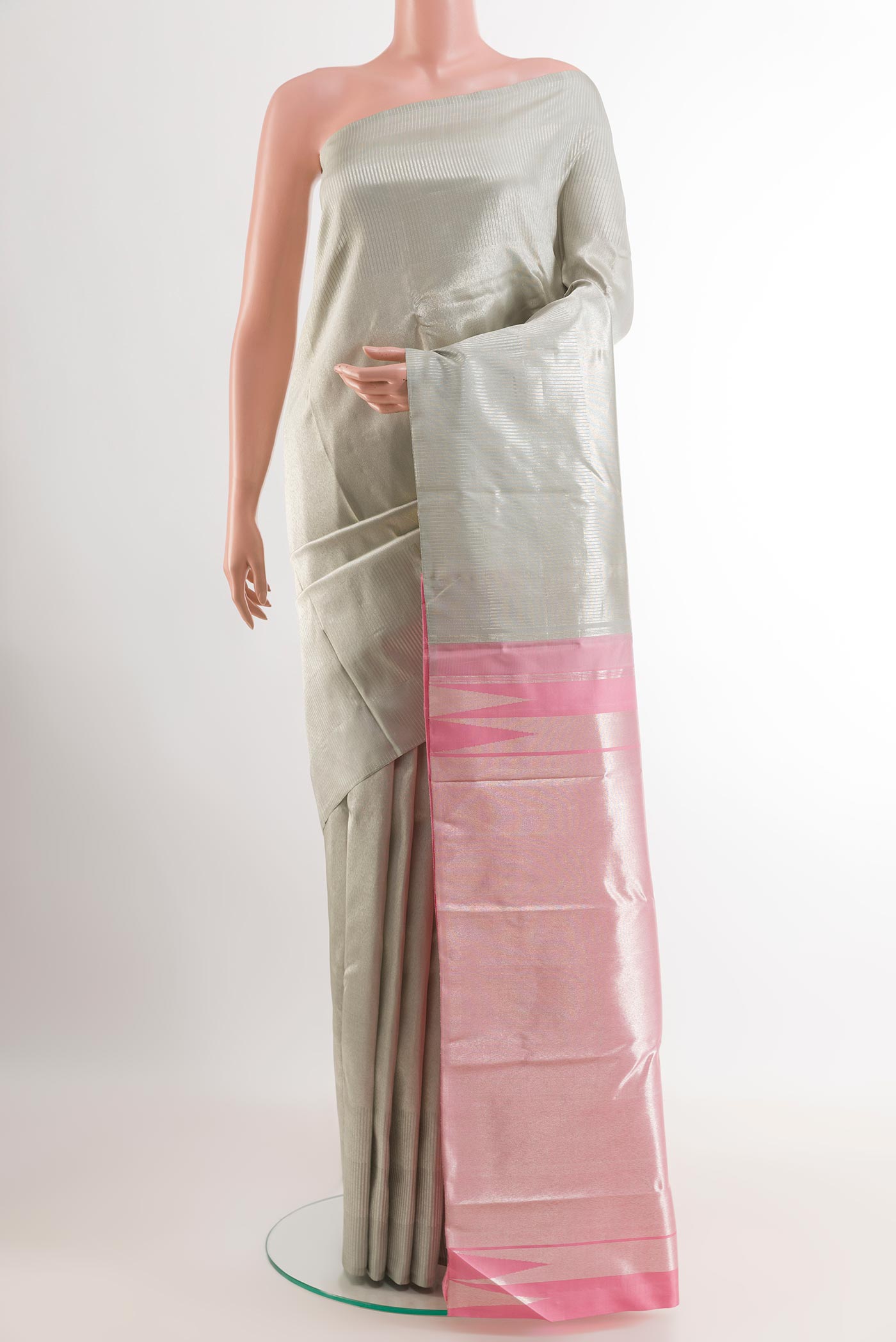 Silver Kanchipuram Silk Saree with Zari Brocade on the body and Zari Border.  displayed on a mannequin