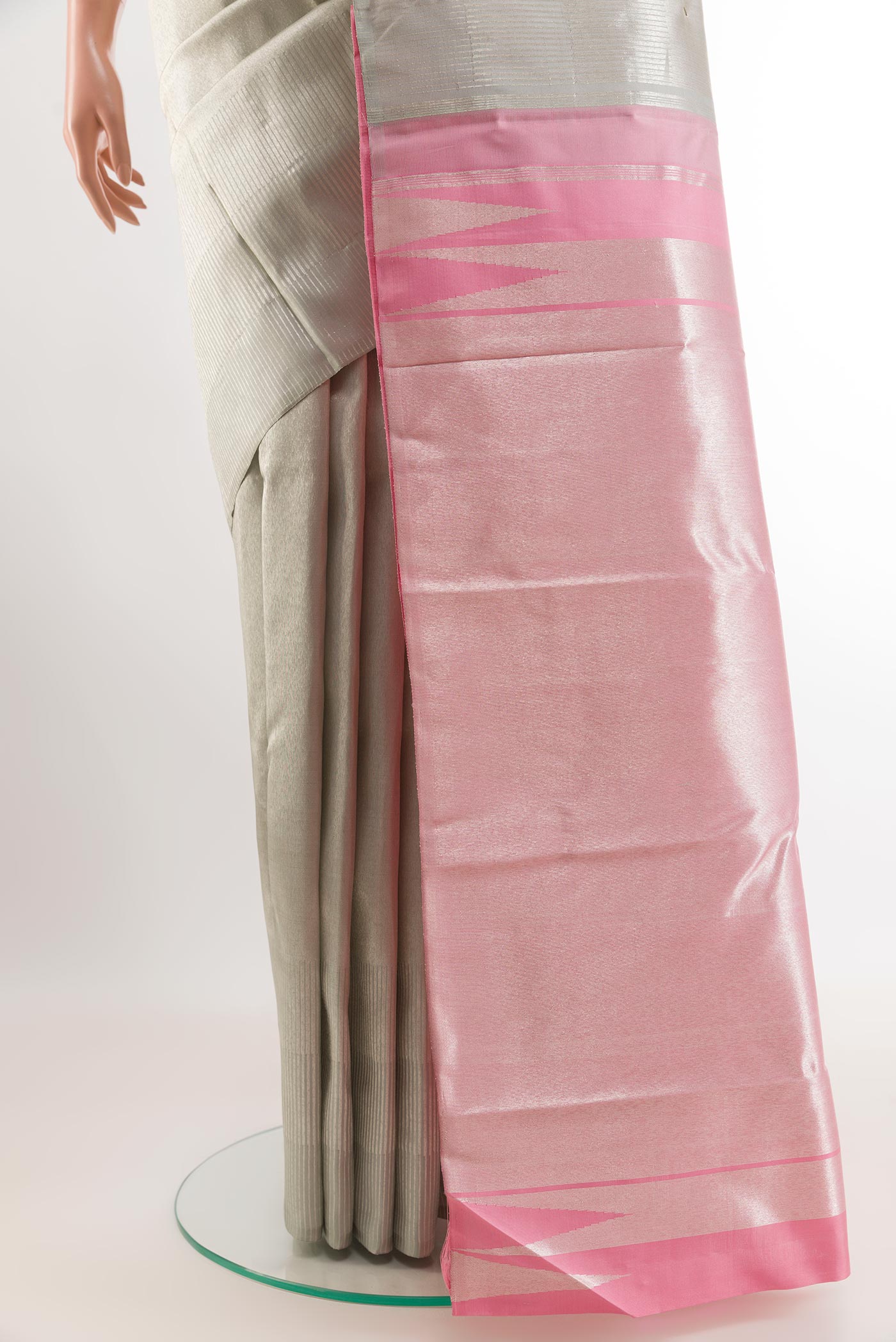 Pleats and pallu of Silver Kanchipuram Silk Saree with Zari Brocade on the body and Zari Border. 