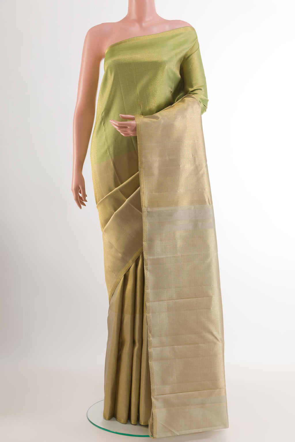 Golden Kanchipuram Silk Saree with Zari Brocade on the body and Zari Border.  displayed on a mannequin