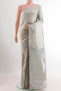 Silver Kanjivaram Silk Saree with Zari Brocade on the body and Zari Border.  displayed on a mannequin
