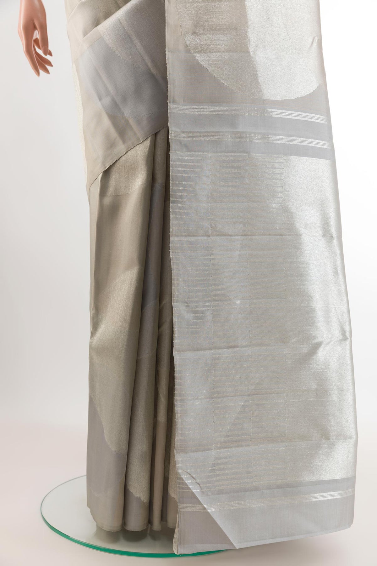 Pleats and pallu of Silver Kanjivaram Silk Saree with Zari Brocade on the body and Zari Border. 