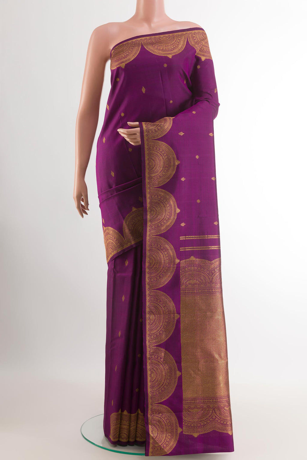 Purple Kanjivaram Silk Saree with Zari Butta on the body and Zari Border.  displayed on a mannequin