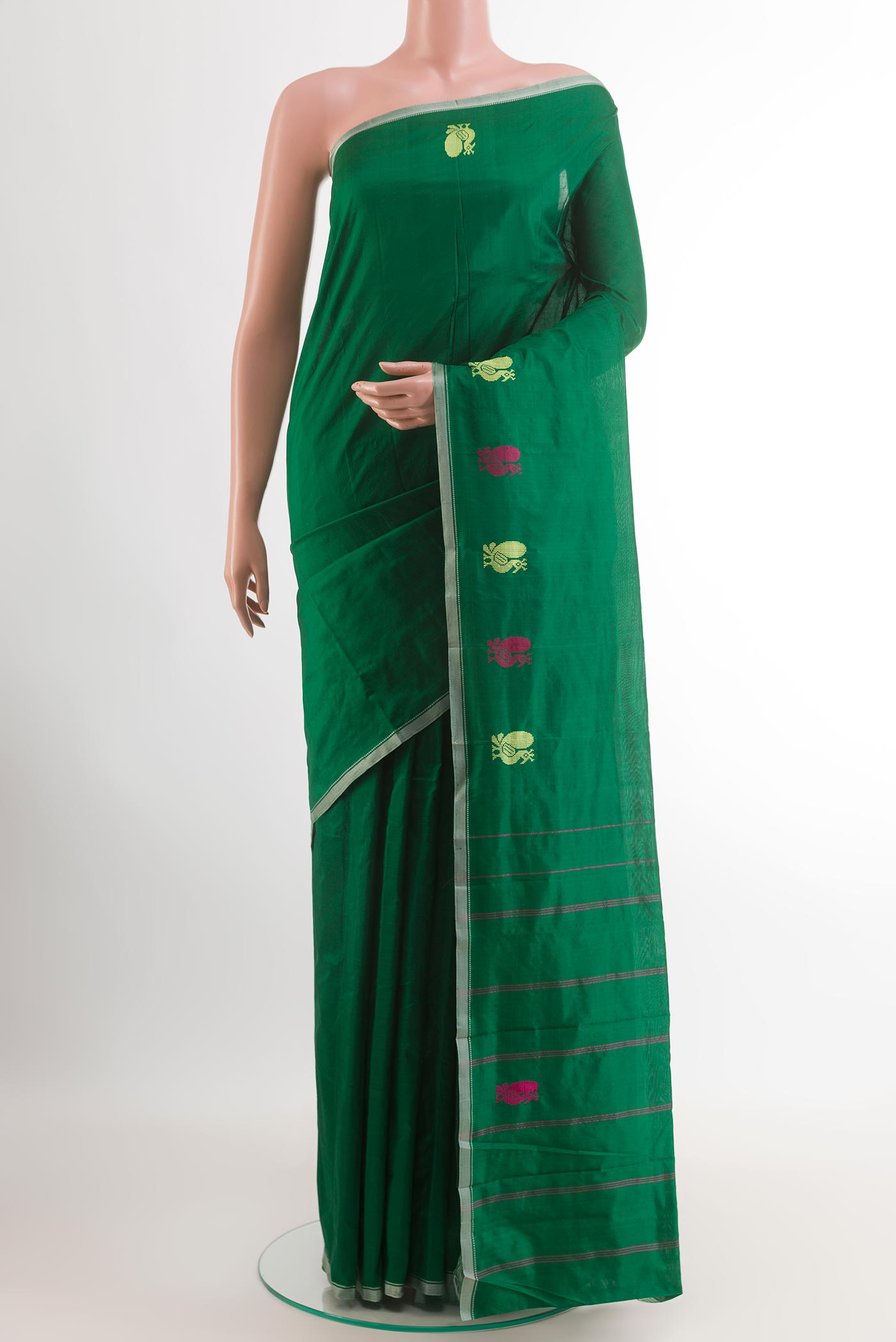 Green Kanchipuram Silk Saree with Plain Body and Thread Border.  displayed on a mannequin