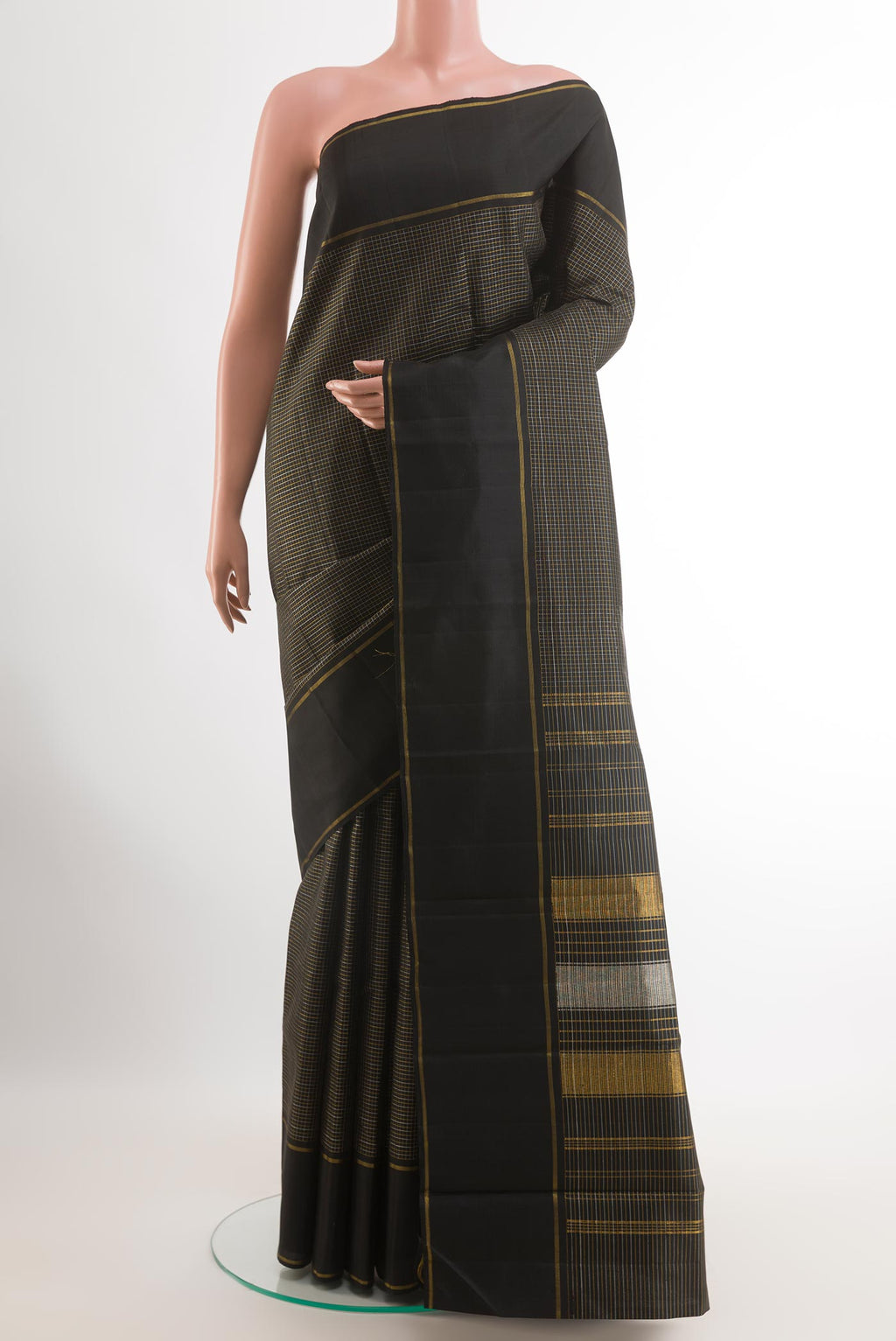 Black Kanchipuram Silk Saree with Checked design on the body and Zari Border.  displayed on a mannequin