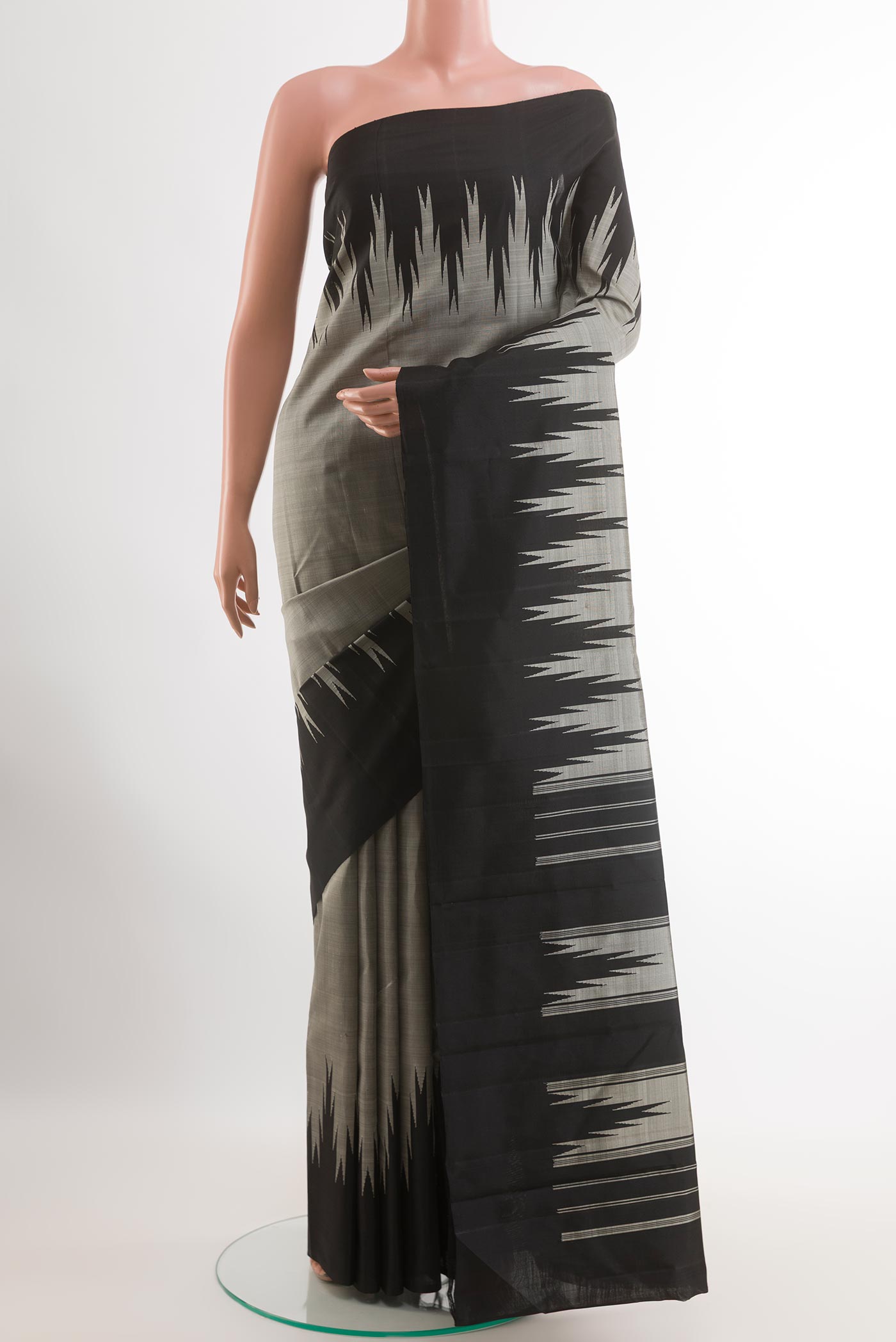 Grey Kanchipuram Silk Saree with Plain Body and Temple Border.  displayed on a mannequin