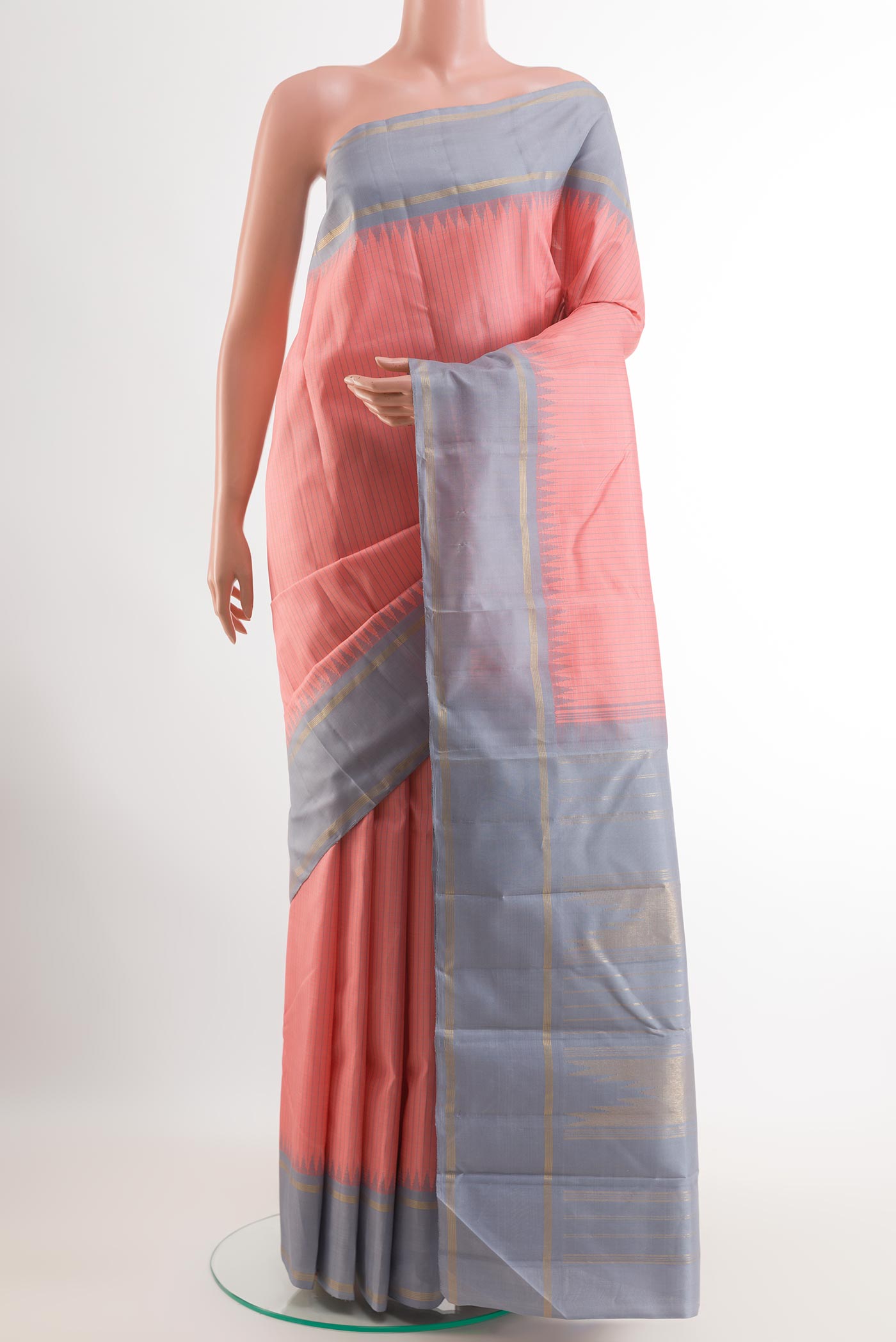 Pink Kanchipuram Silk Saree with Checked design on the body and Zari Border.  displayed on a mannequin