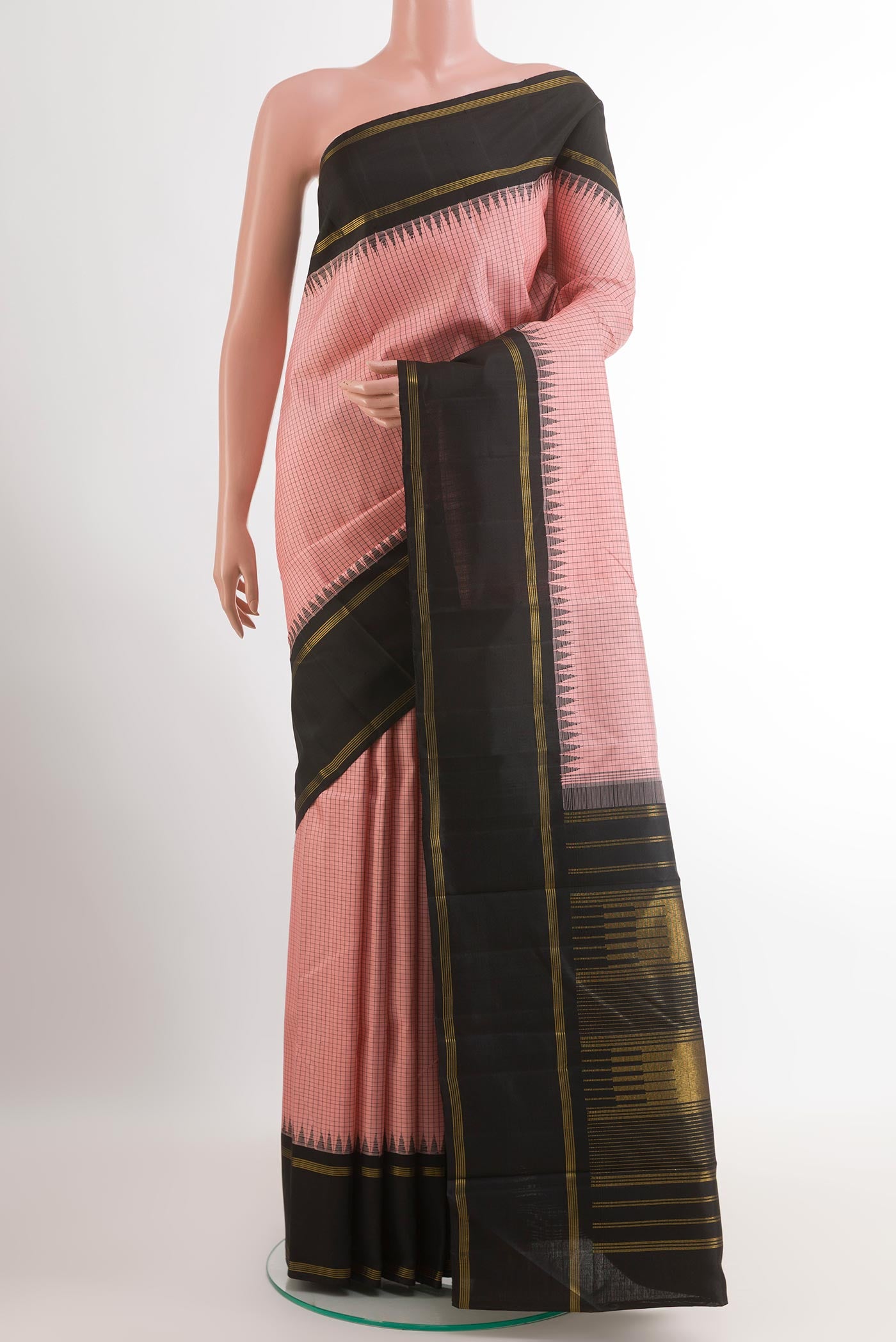 Pink Kanchipuram Silk Saree with Checked design on the body and Zari Border.  displayed on a mannequin
