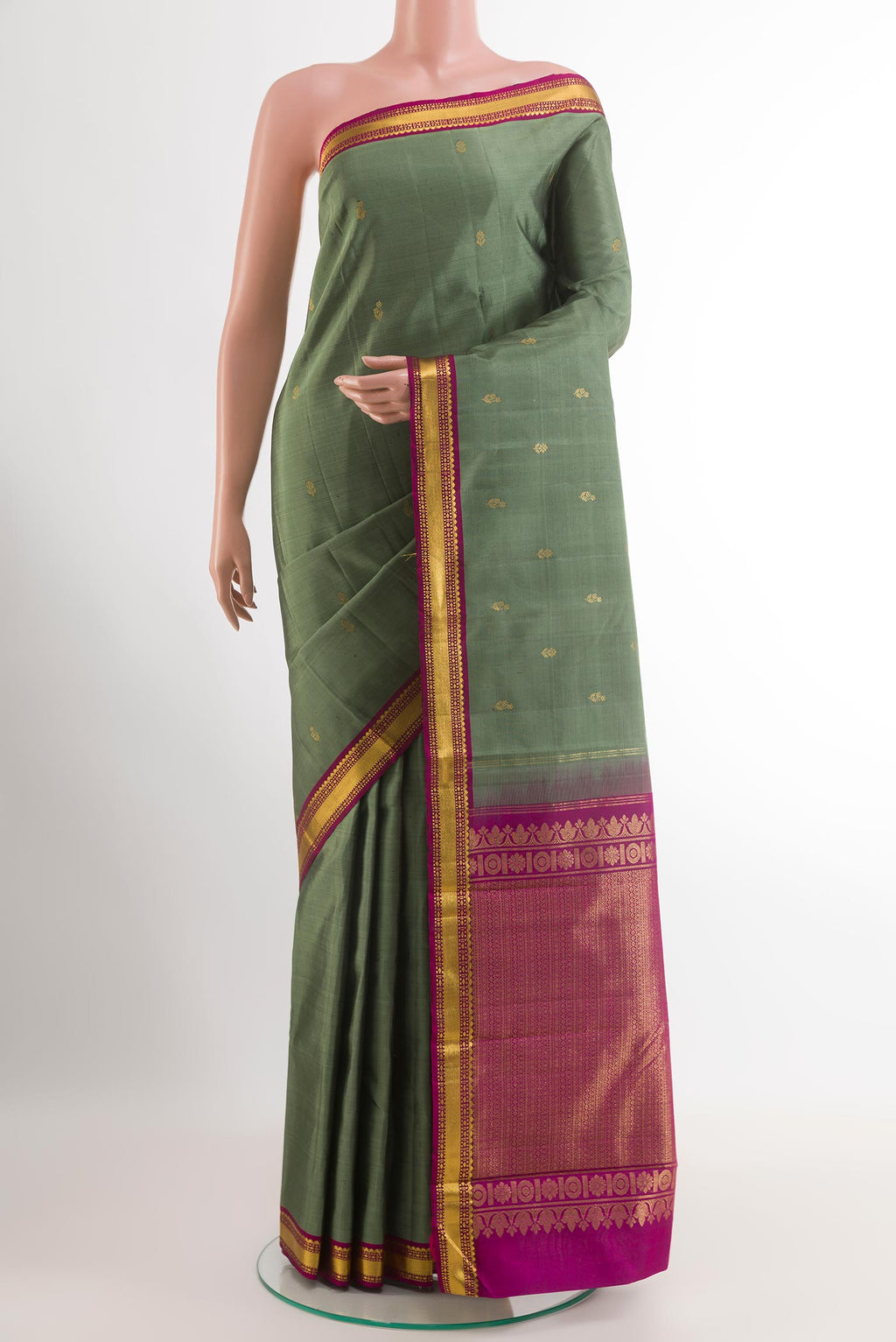 Grey Kanchipuram Silk Saree with Zari Butta on the body and Zari Border.  displayed on a mannequin
