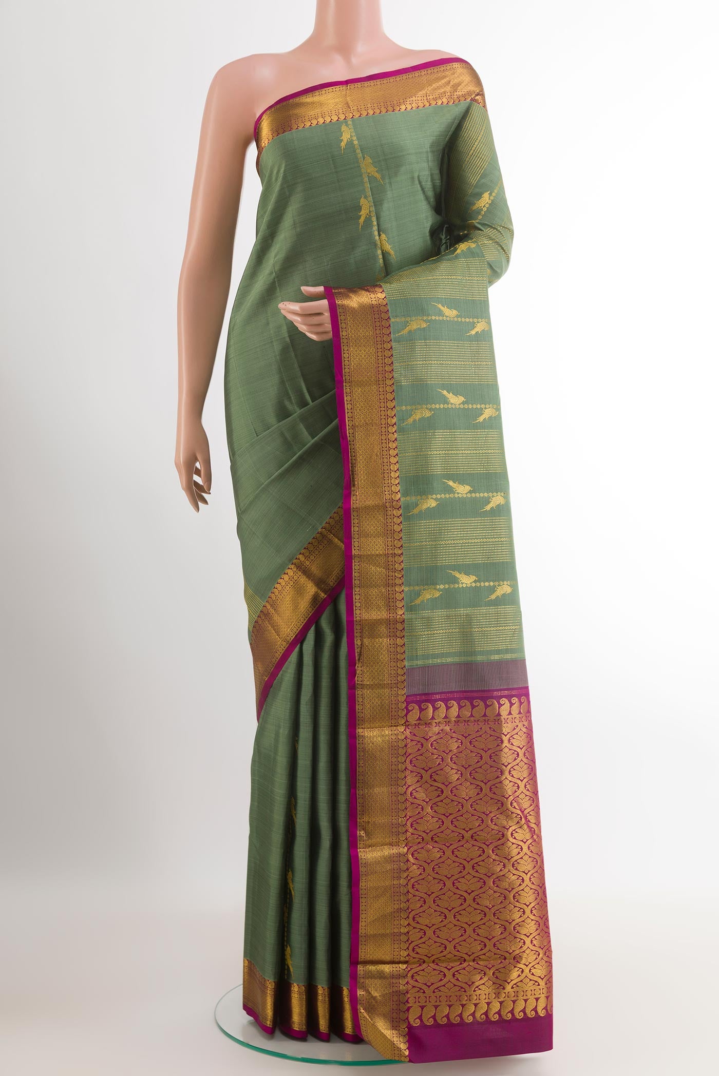 Davys Grey Kanjivaram Silk Saree with Zari Brocade on the body and Zari Border.  displayed on a mannequin