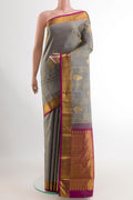 Grey Kanjivaram Silk Saree with Zari Butta on the body and Zari Border.  displayed on a mannequin