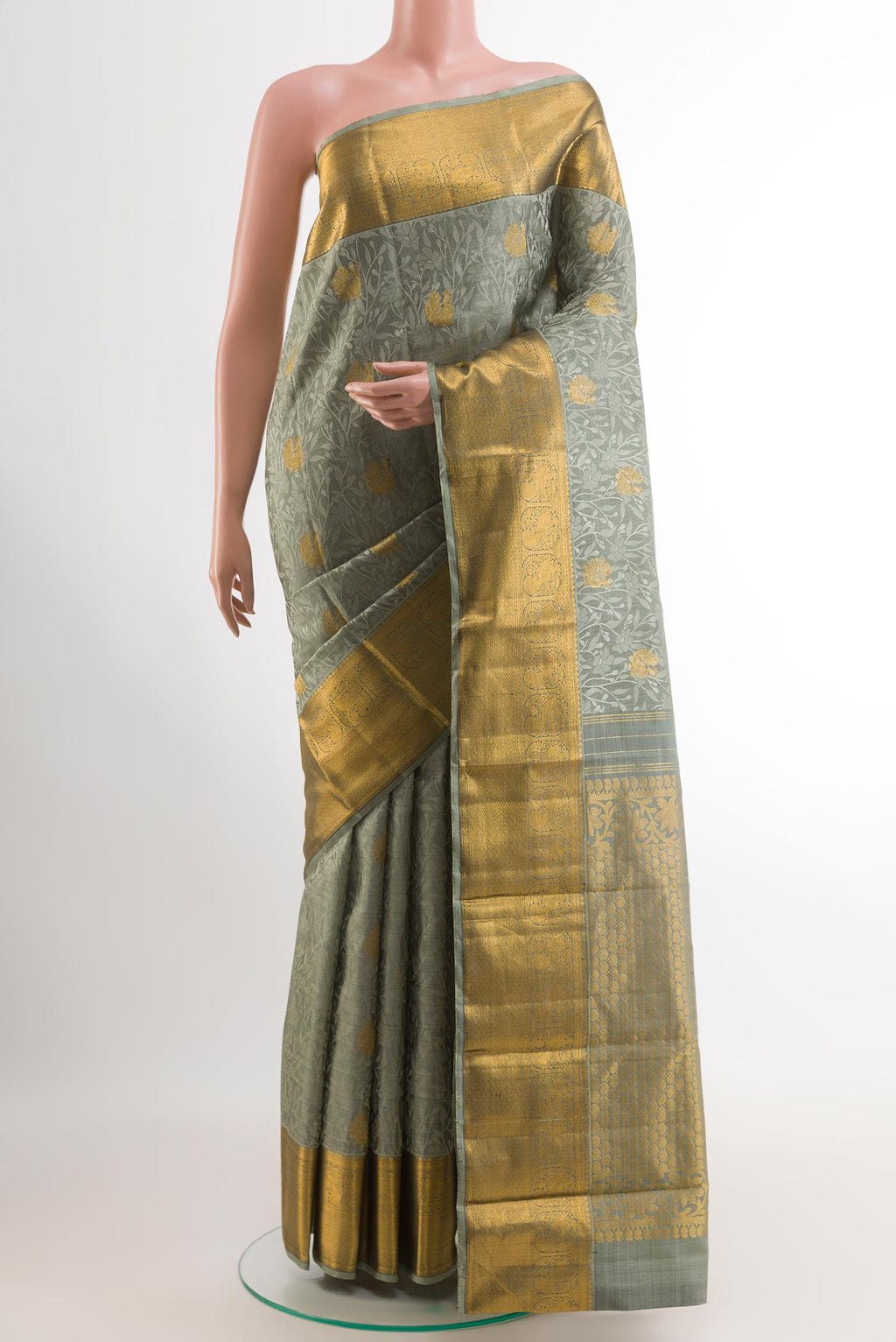 Grey Kanjivaram Silk Saree with Jacquard With Zari Butta on the body and Zari Border.  displayed on a mannequin