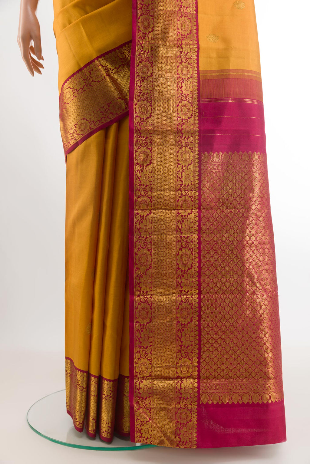 Pleats and pallu of Mustard Kanjivaram Silk Saree with Zari Butta on the body and Zari Border. 