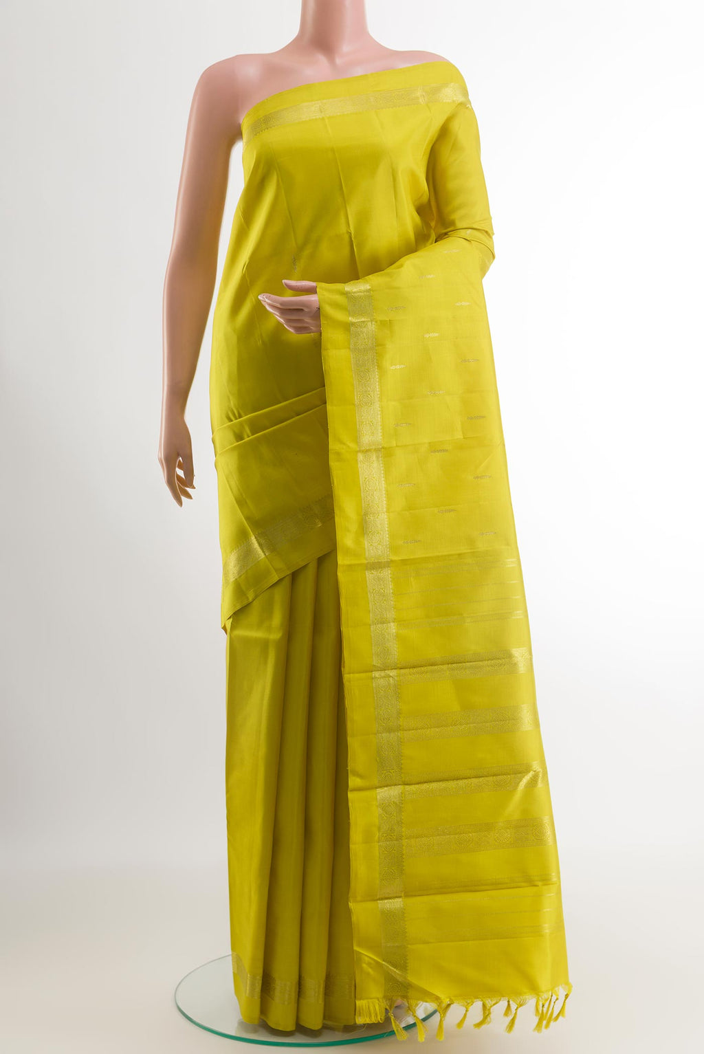 Yellow Kanchipuram Silk Saree with Zari Butta on the body and Zari Border.  displayed on a mannequin