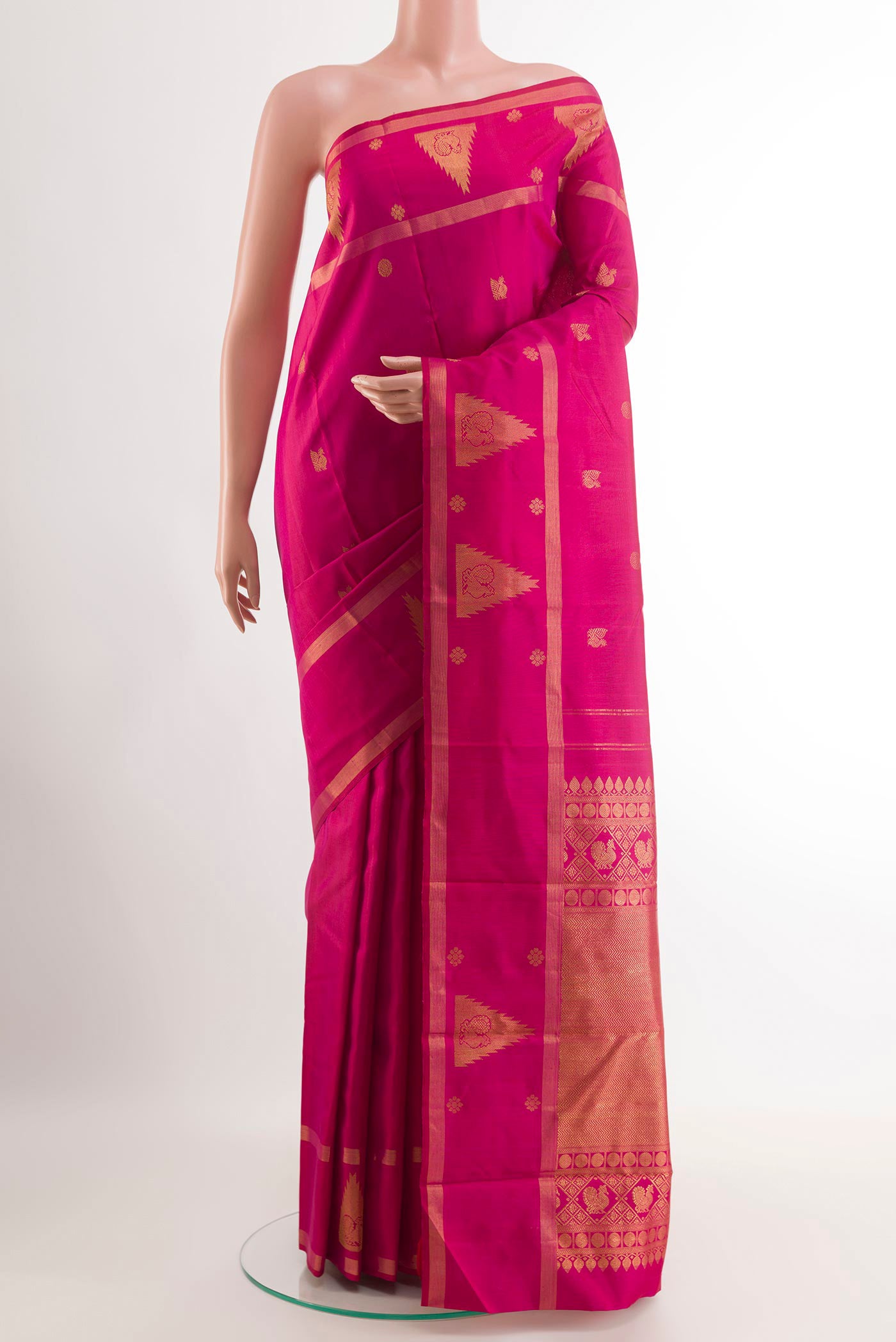 Pink Kanjivaram Silk Saree with Zari Butta on the body and Zari Border.  displayed on a mannequin